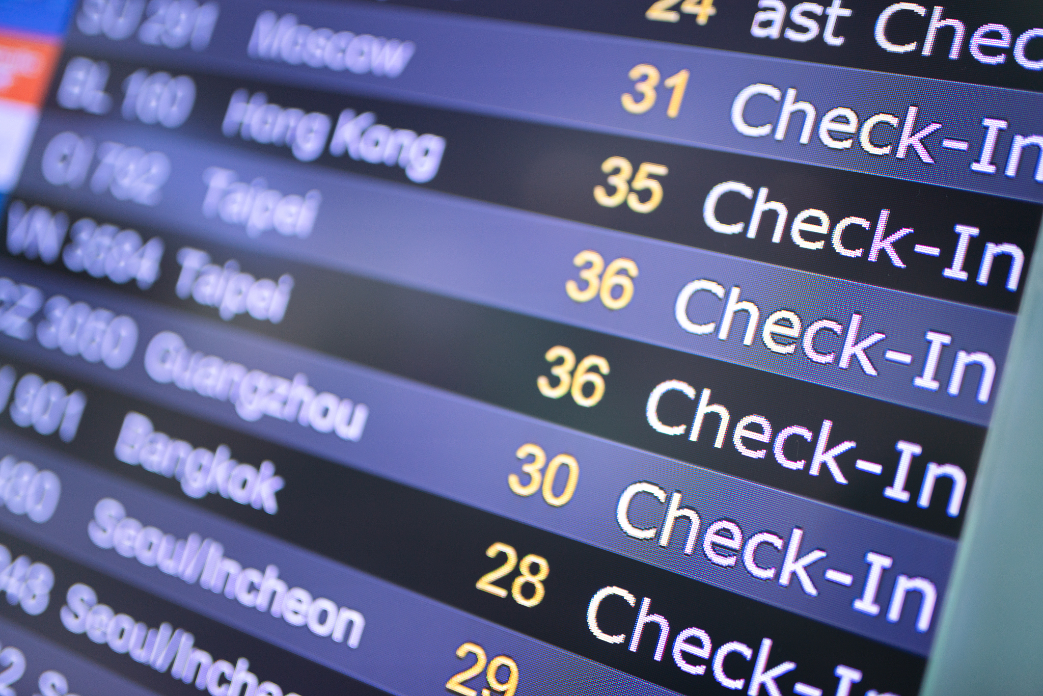 departure status on the digital display in the airport.