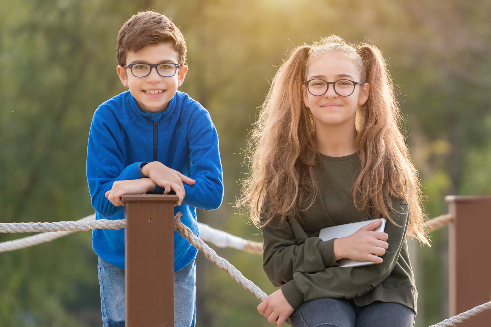 happy sibling  having fun at the park