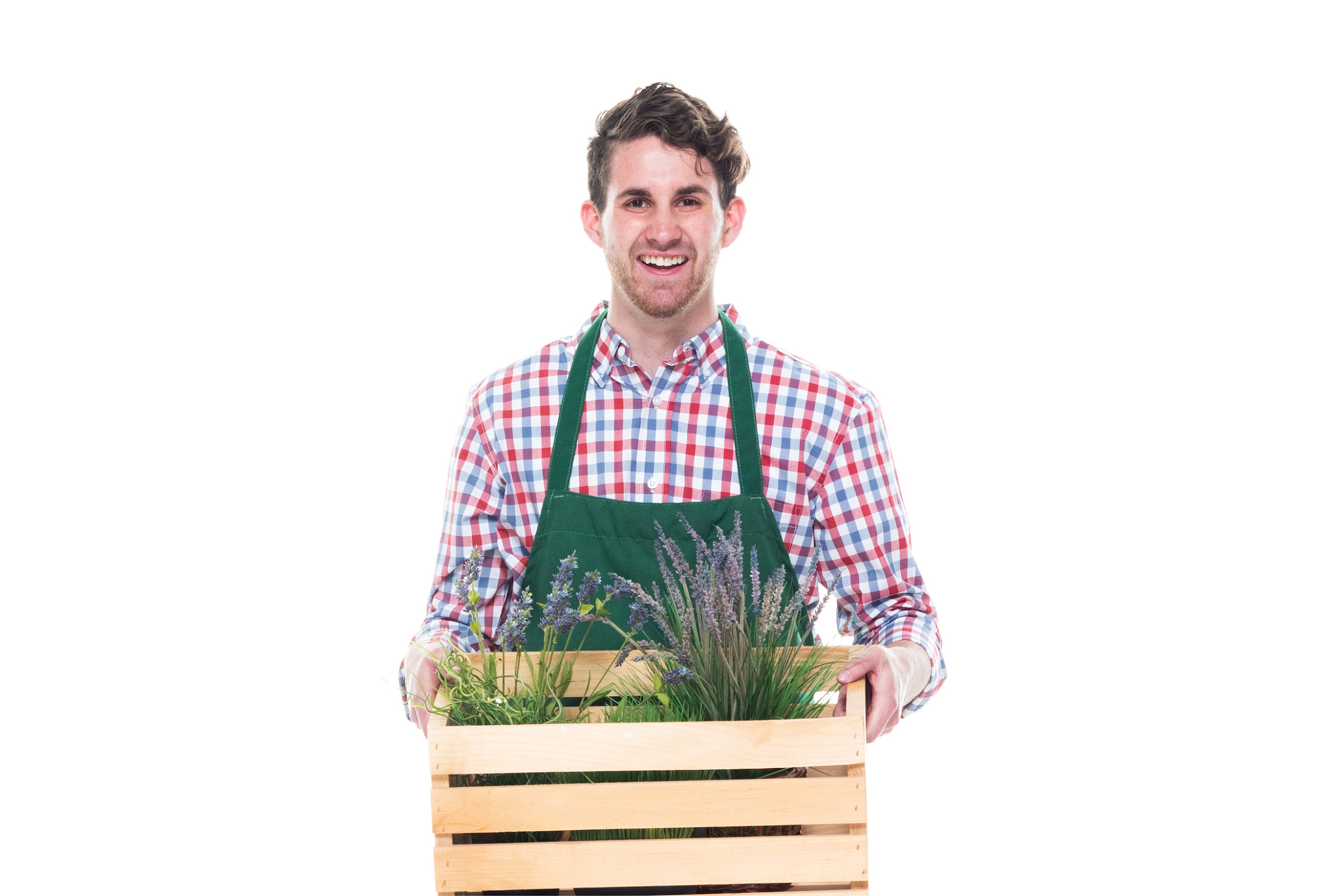 happy male florist holding a basket with plants and walking