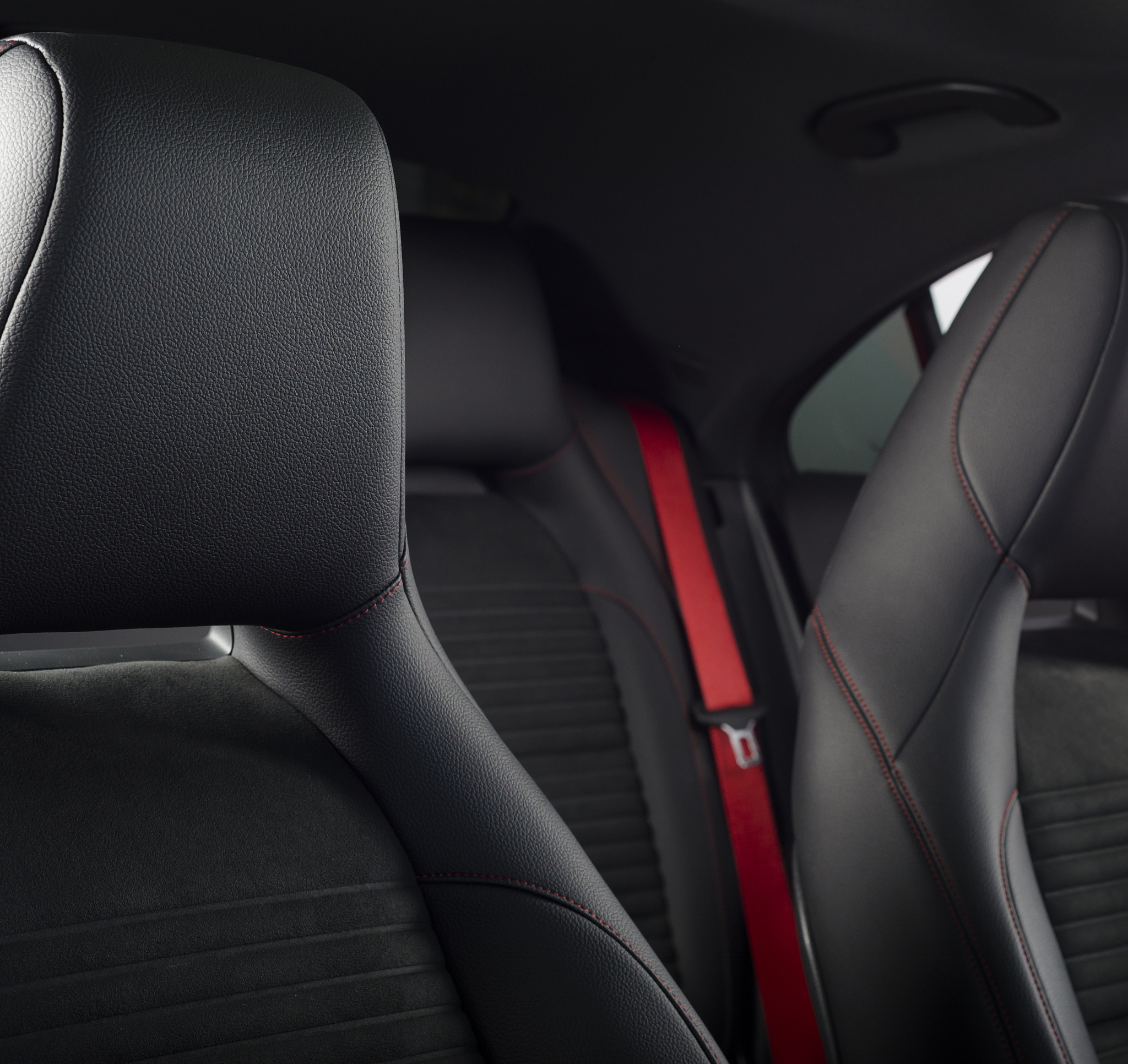 leather car seats  detail with focus on stitch