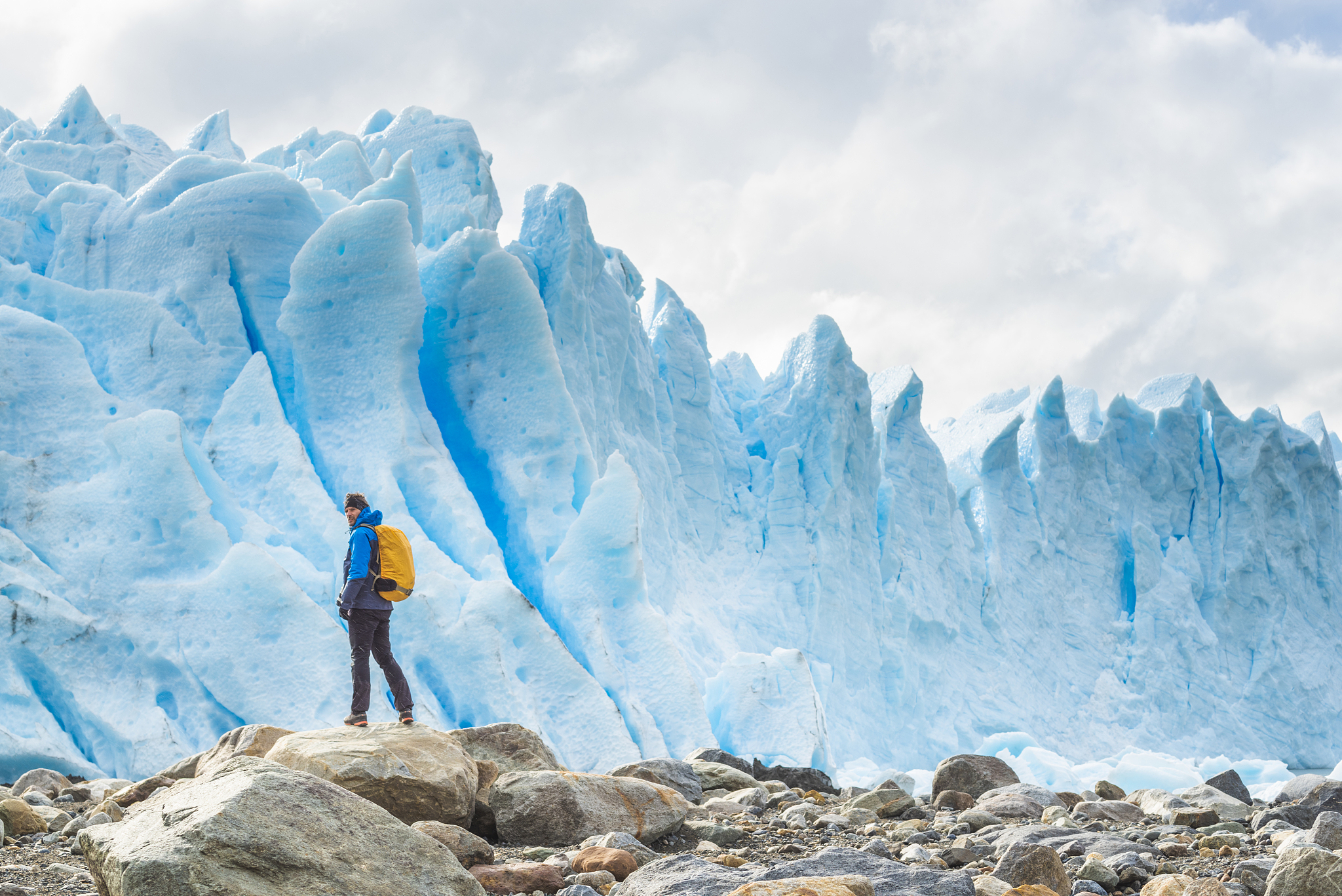 tourist admiring the front of perito moreno glacier, argentina