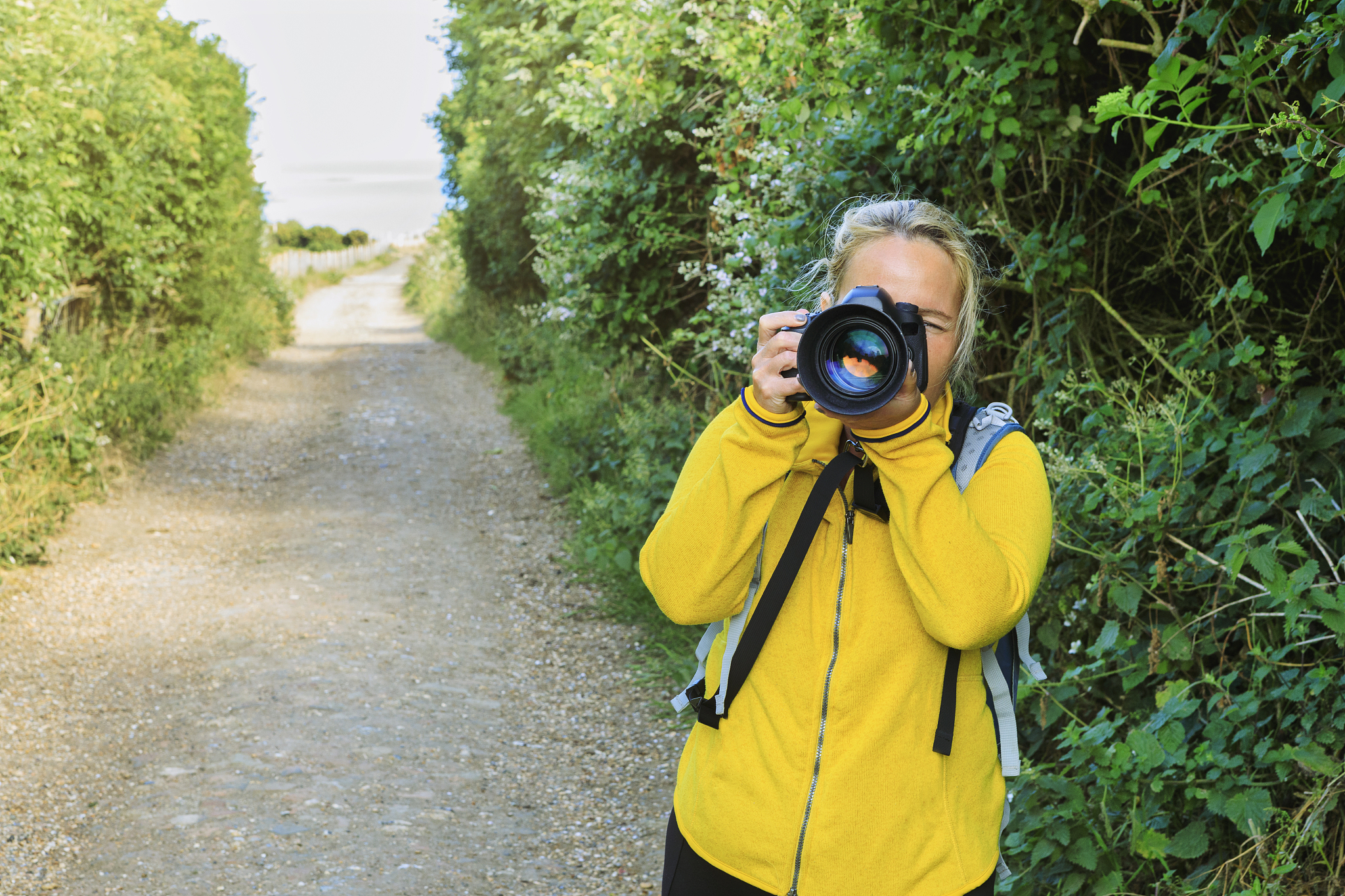woman using dslr camera