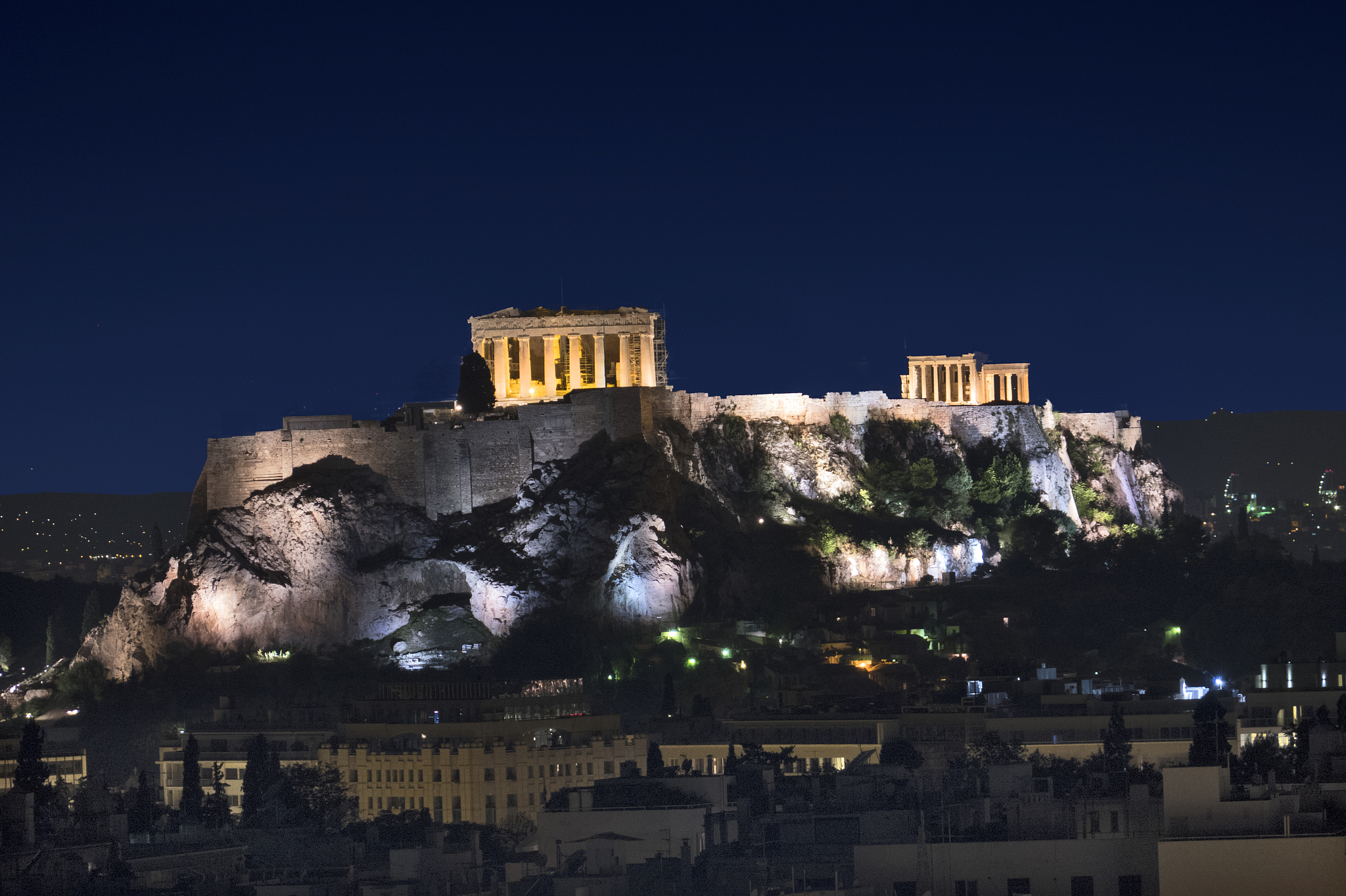 the parthenon and acropolis illuminated,seen from the hilton hot