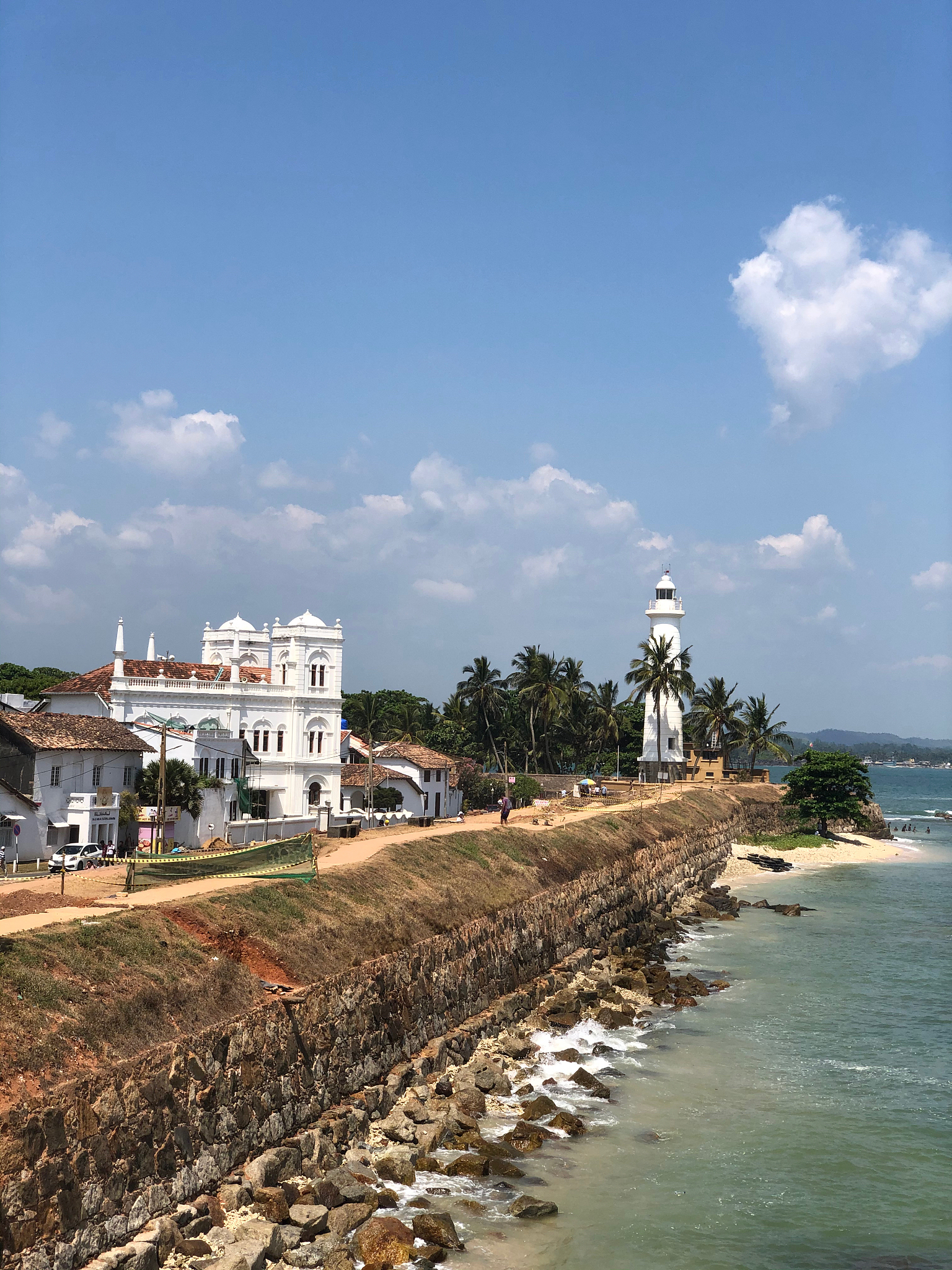 building by sea against sky