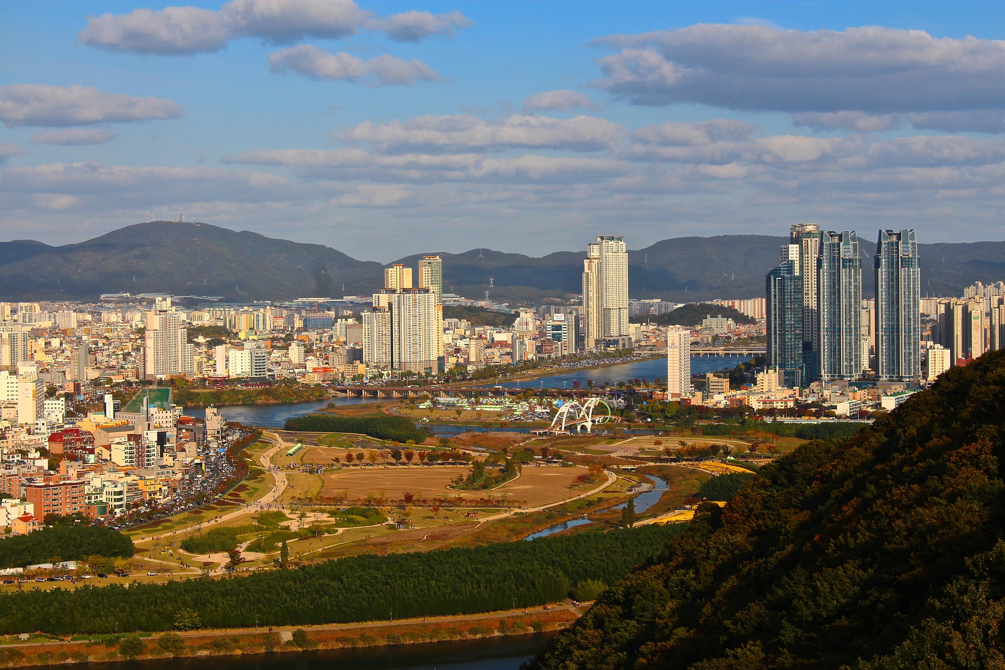 cityscape against cloudy sky