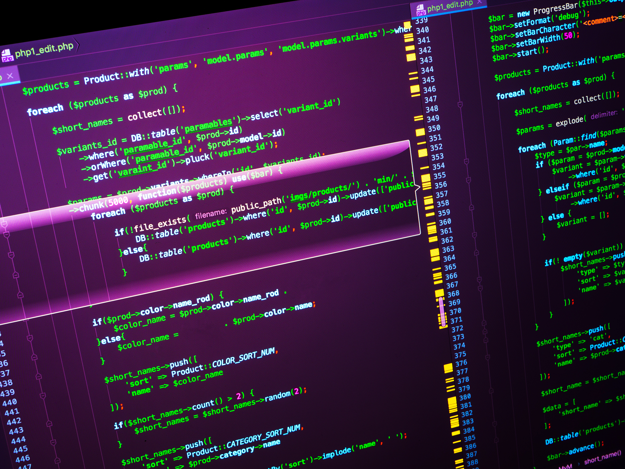 lines of php code on the monitor on pink background, close up