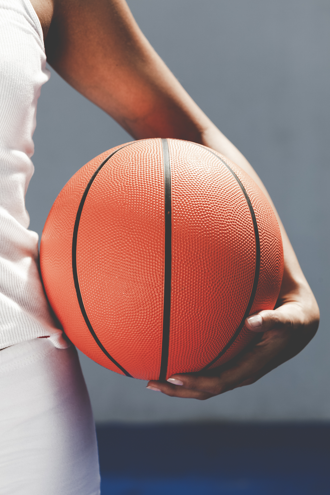 female basketball player holding a ball