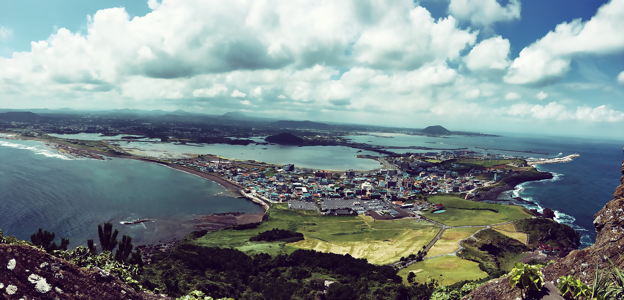 high angle view of cityscape against cloudy sky