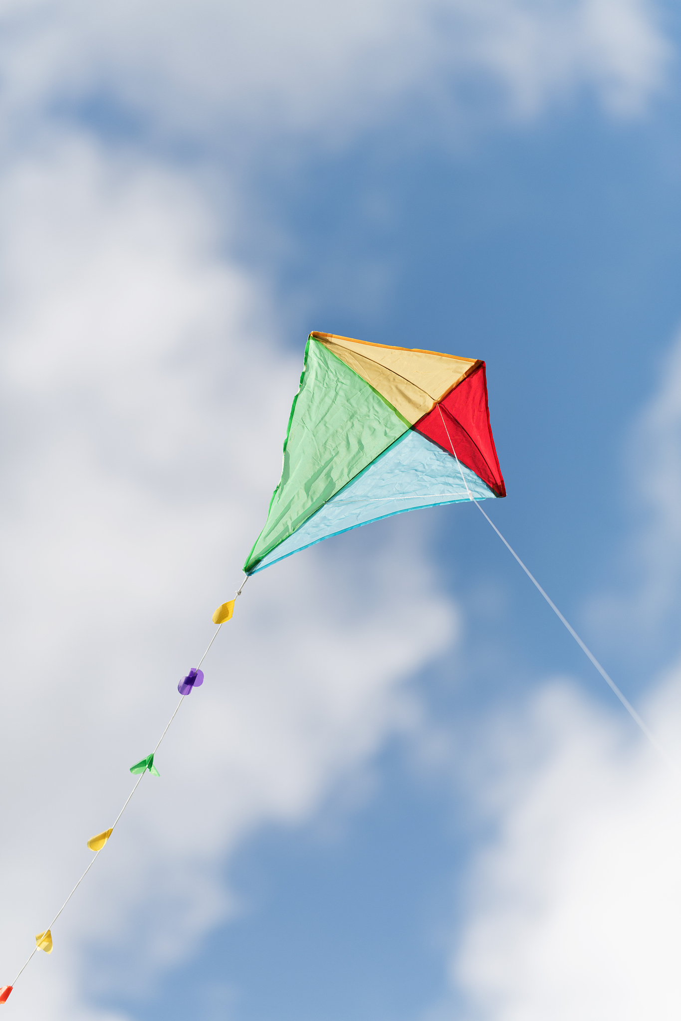 colorful kite in a cloudy sky