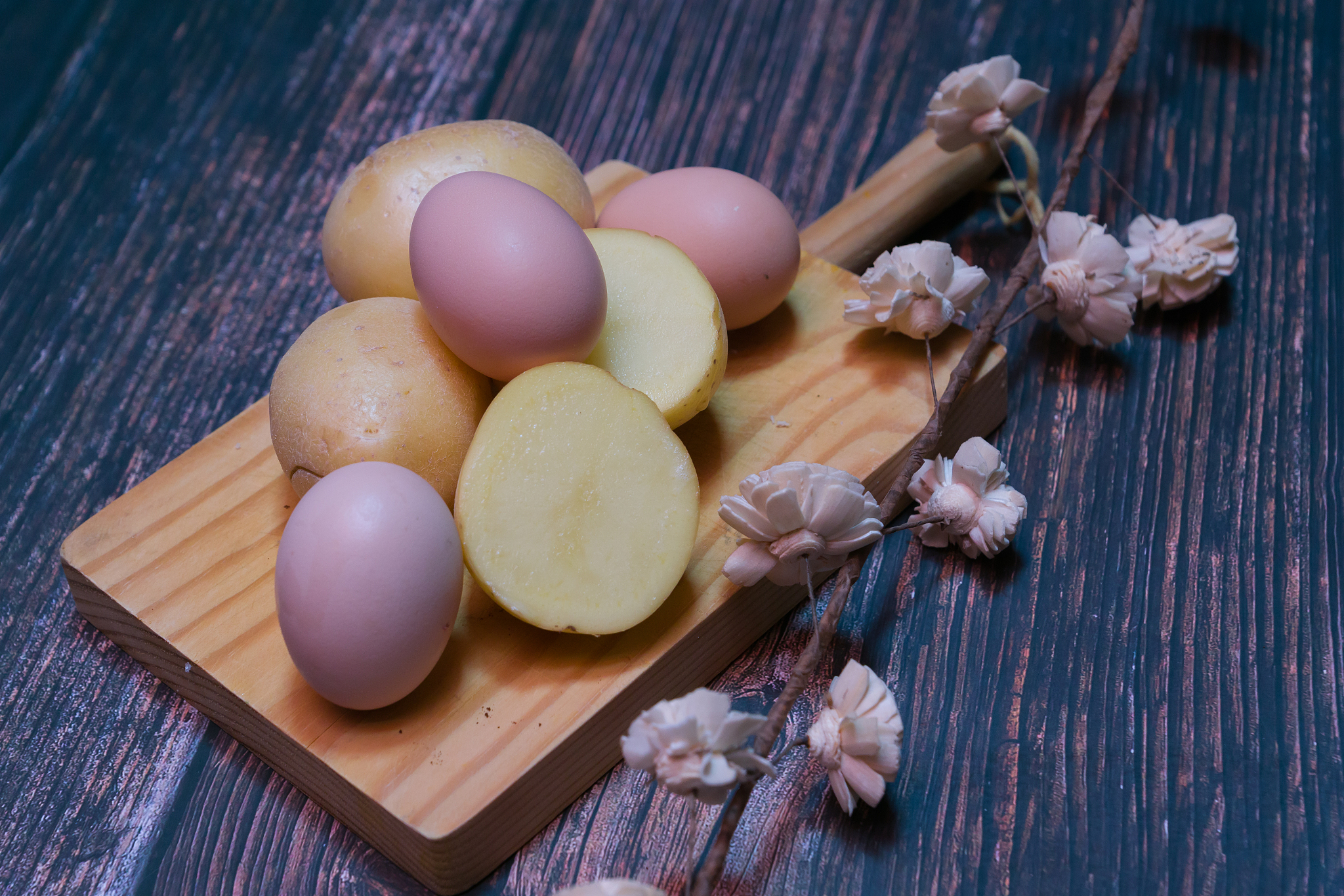 cutting board, eggs and potatoes