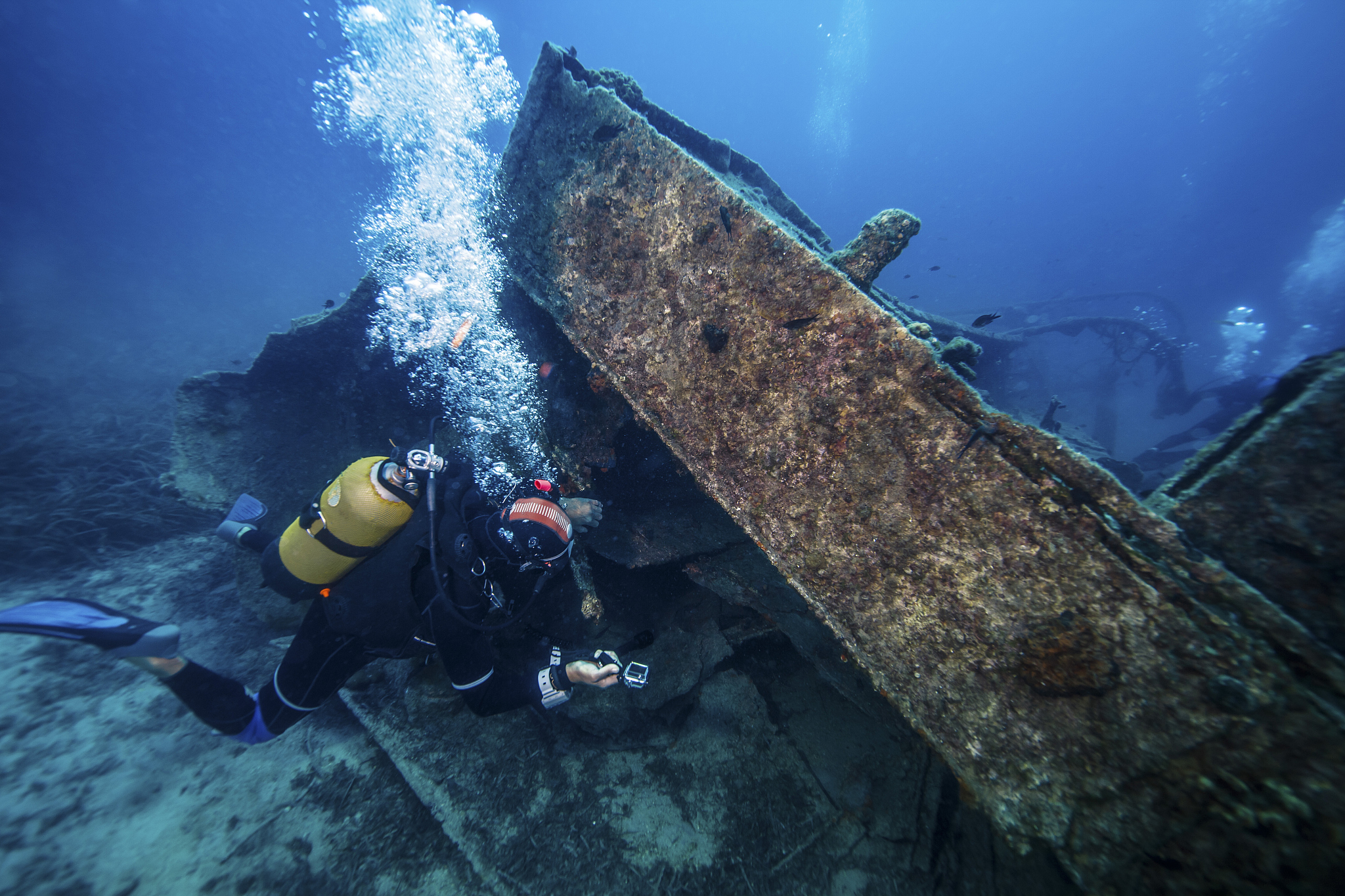 scuba diver exploring shipwreck, adriatic sea, dalmatia, croatia