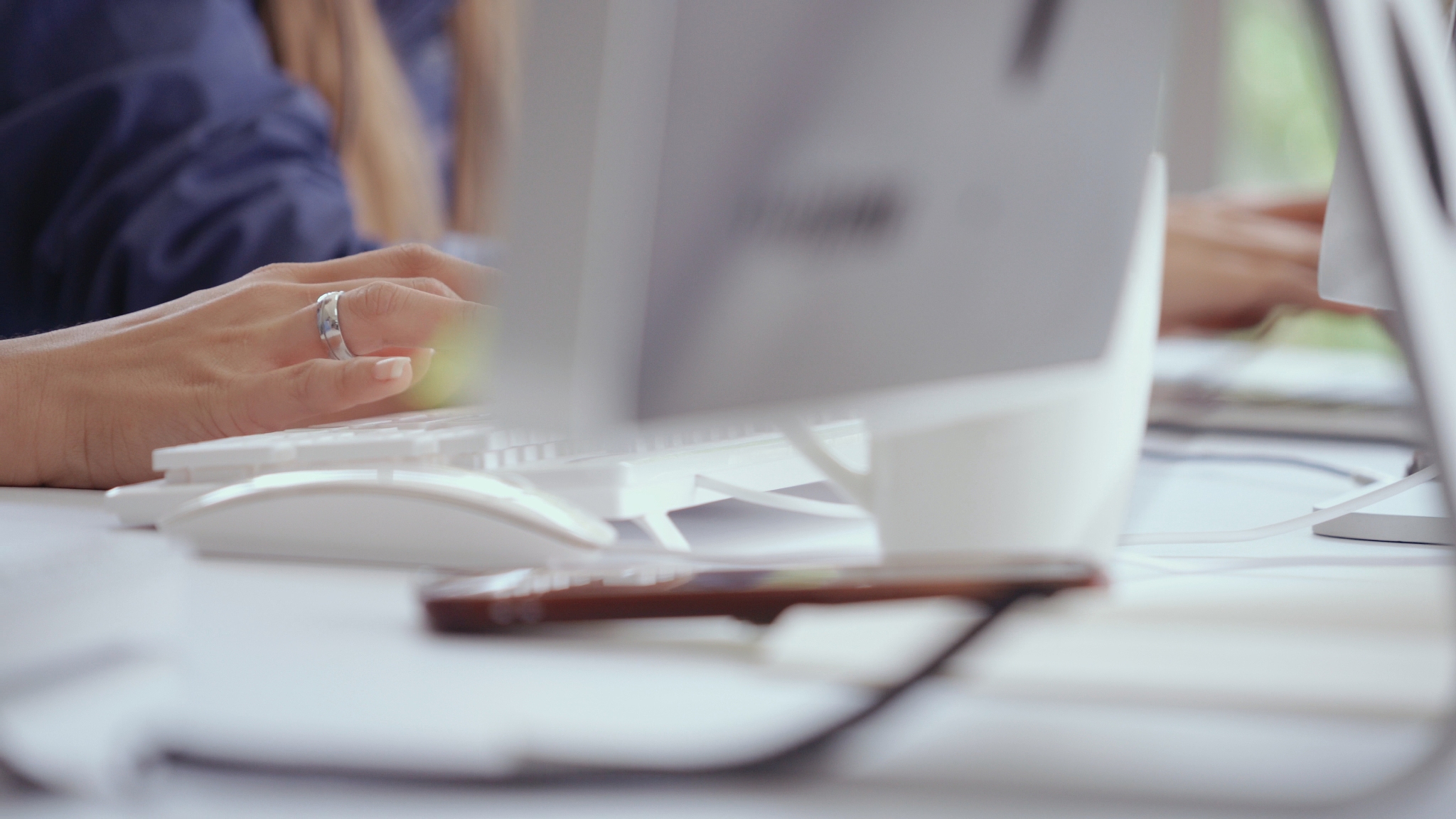 businesswoman hand typing on computer at desk.