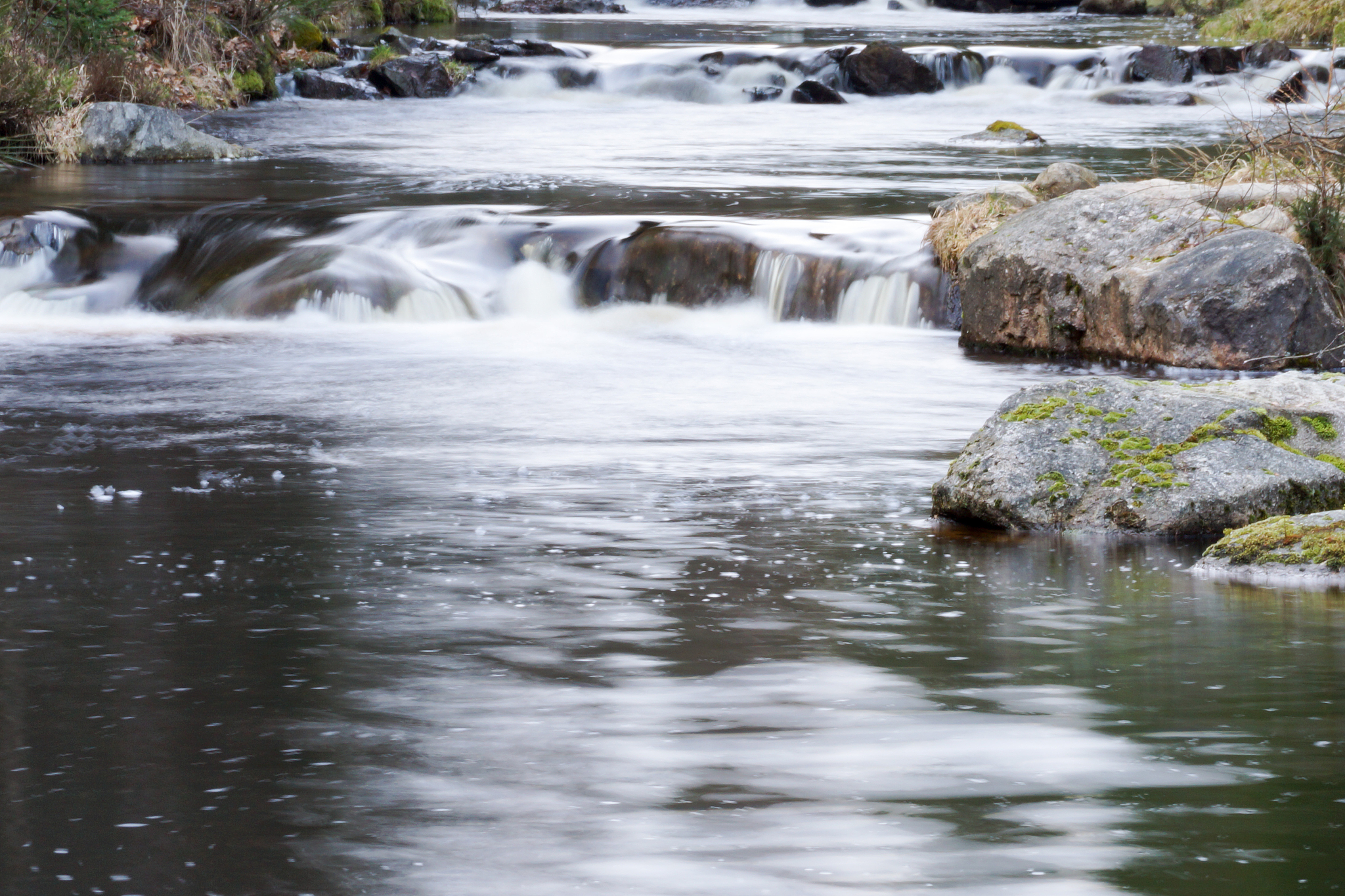stream flowing through rocks