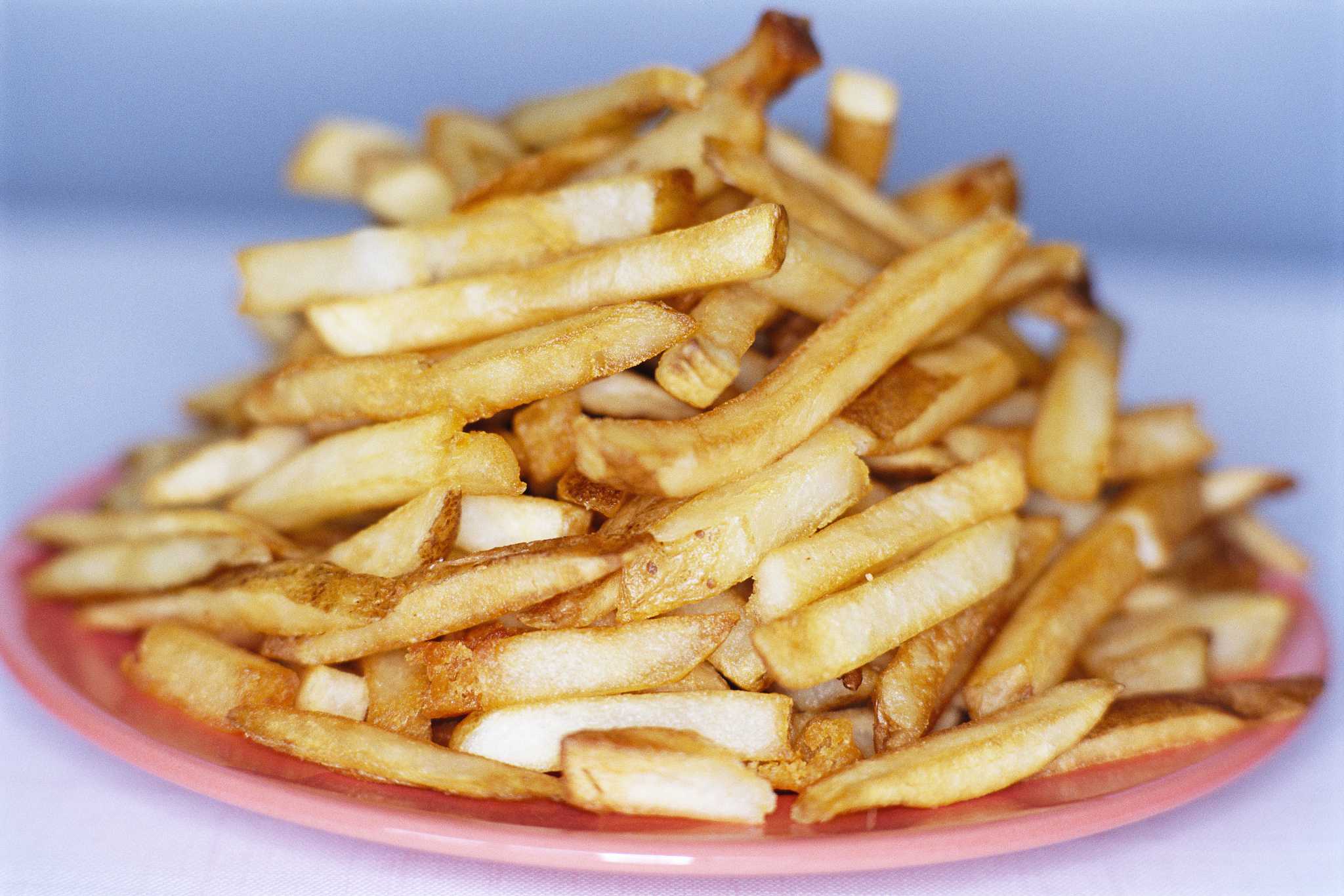 stack of french fries on plate