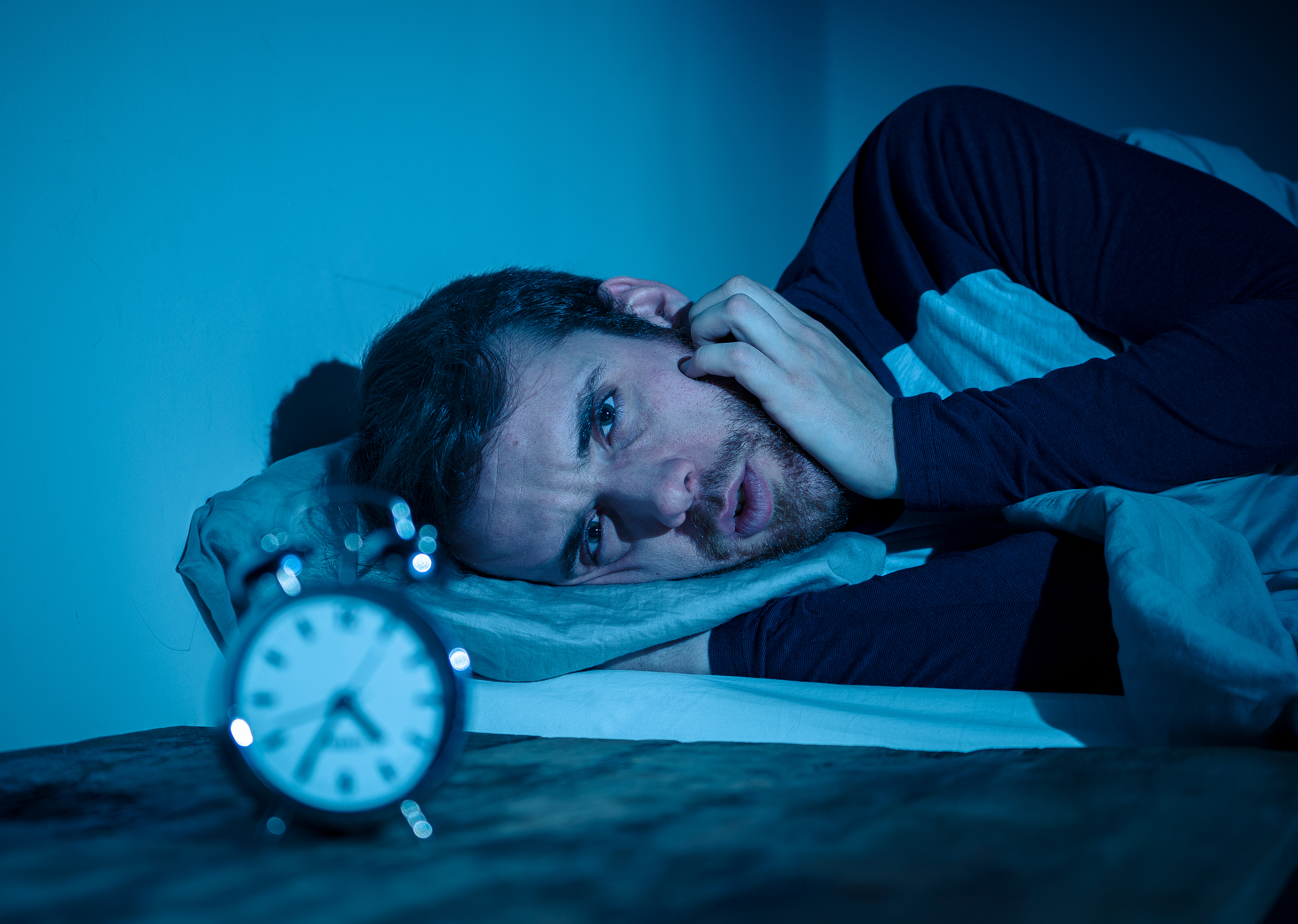 sleepless and desperate young caucasian man awake at night not a