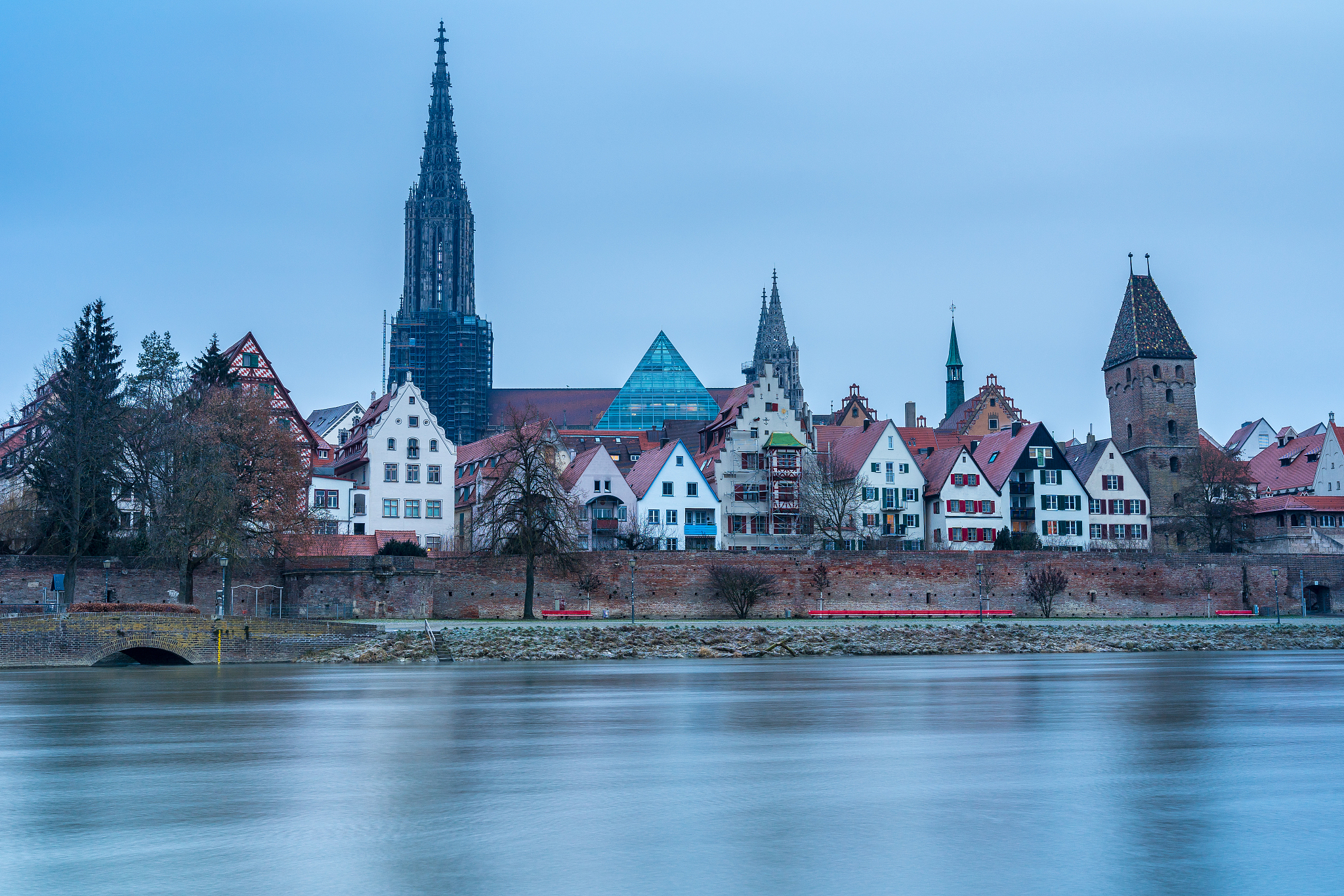 germany, riverside and houses next to famous minster of city ulm