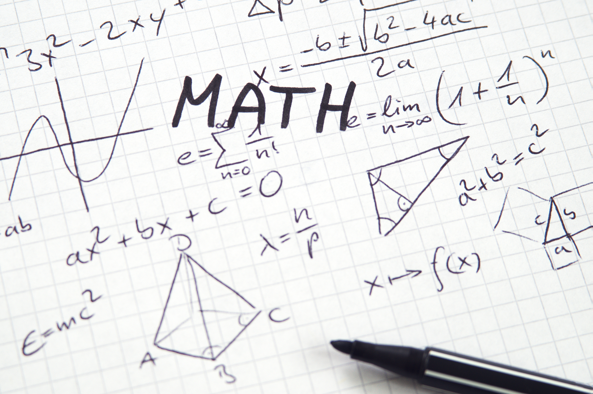 word math in handwriting on checkered paper with misc algebra no