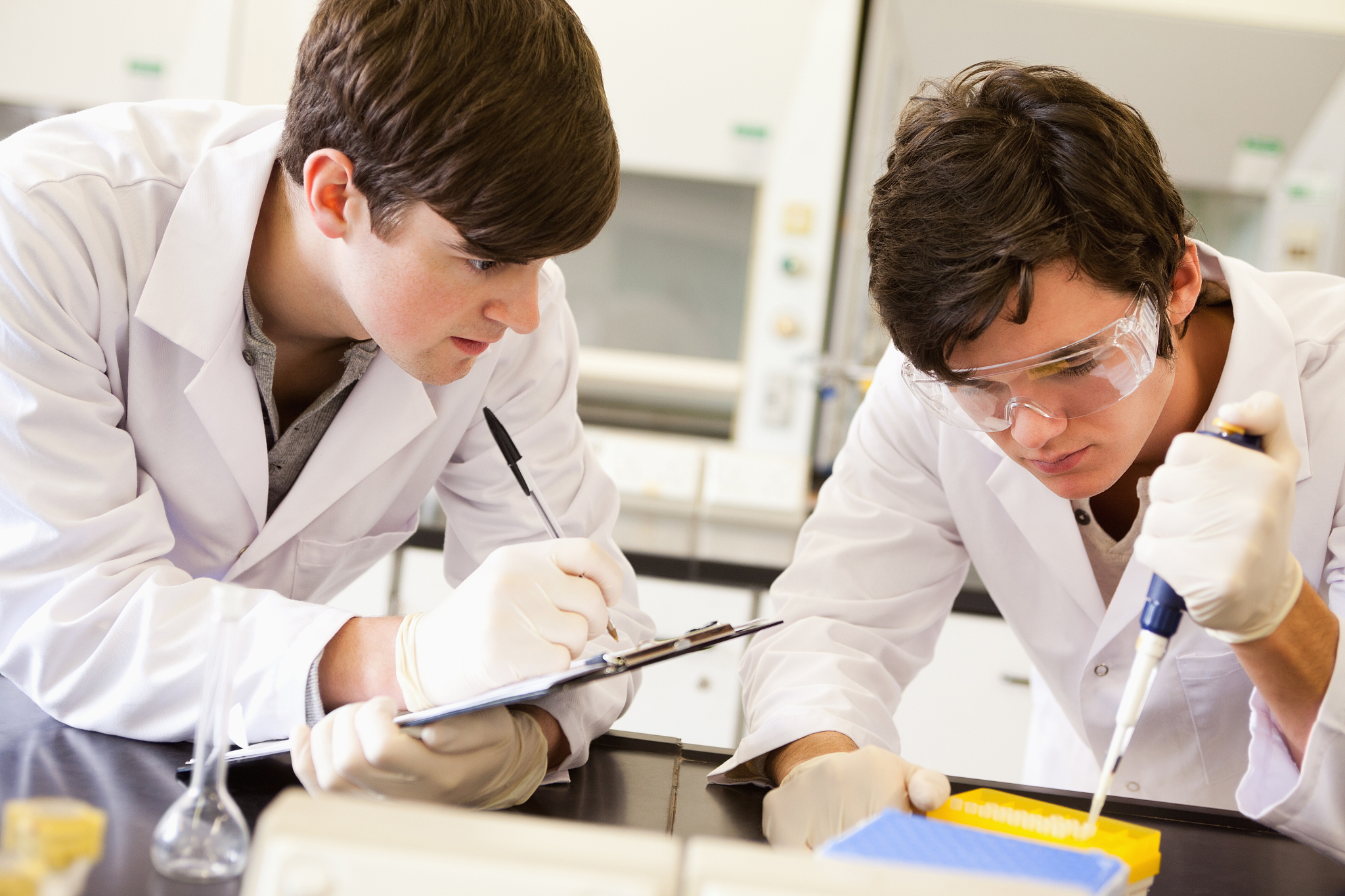 male scientists making an experiment