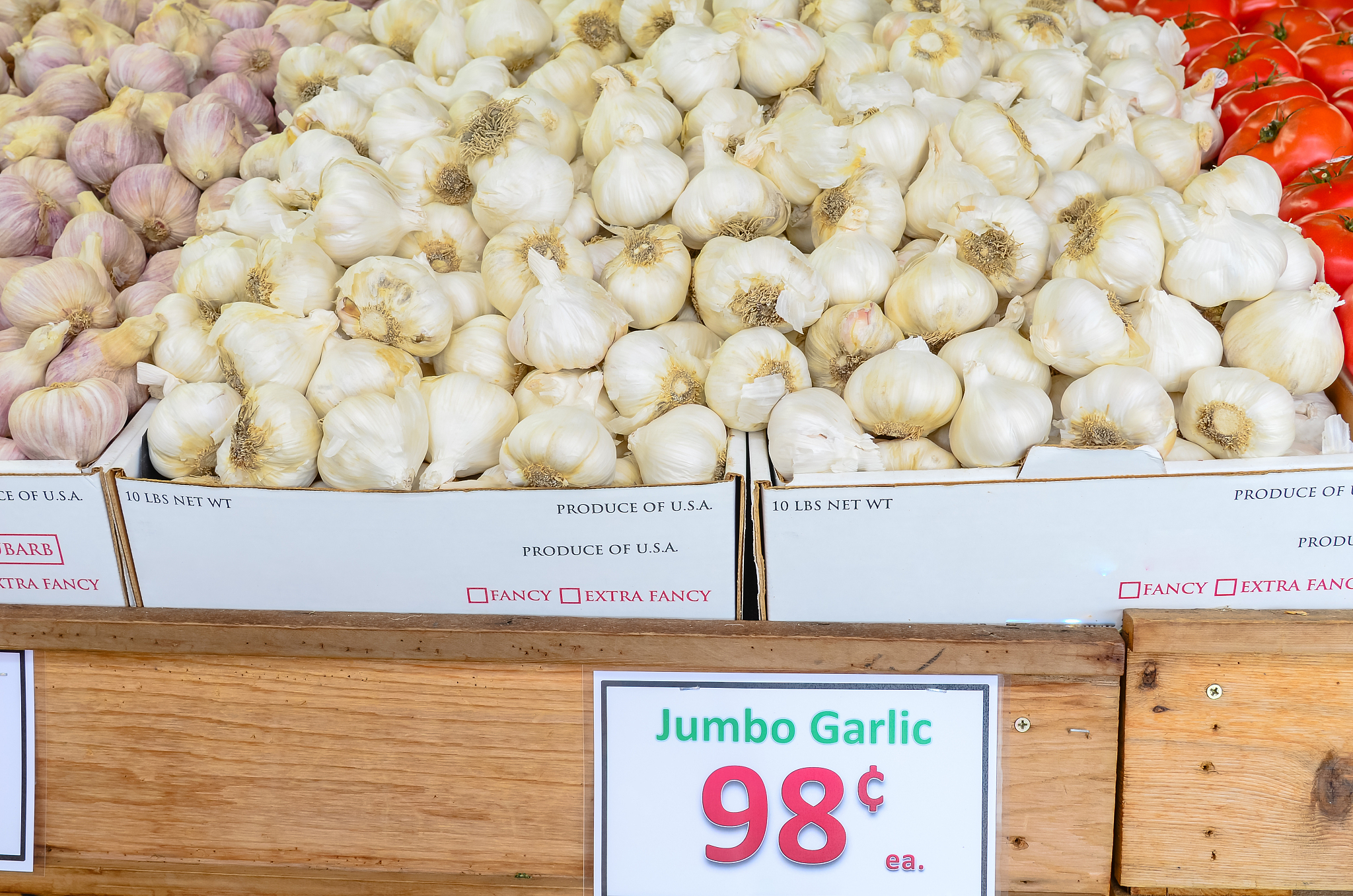 organic jumbo garlic (or elephant garlic) pile with price tag at