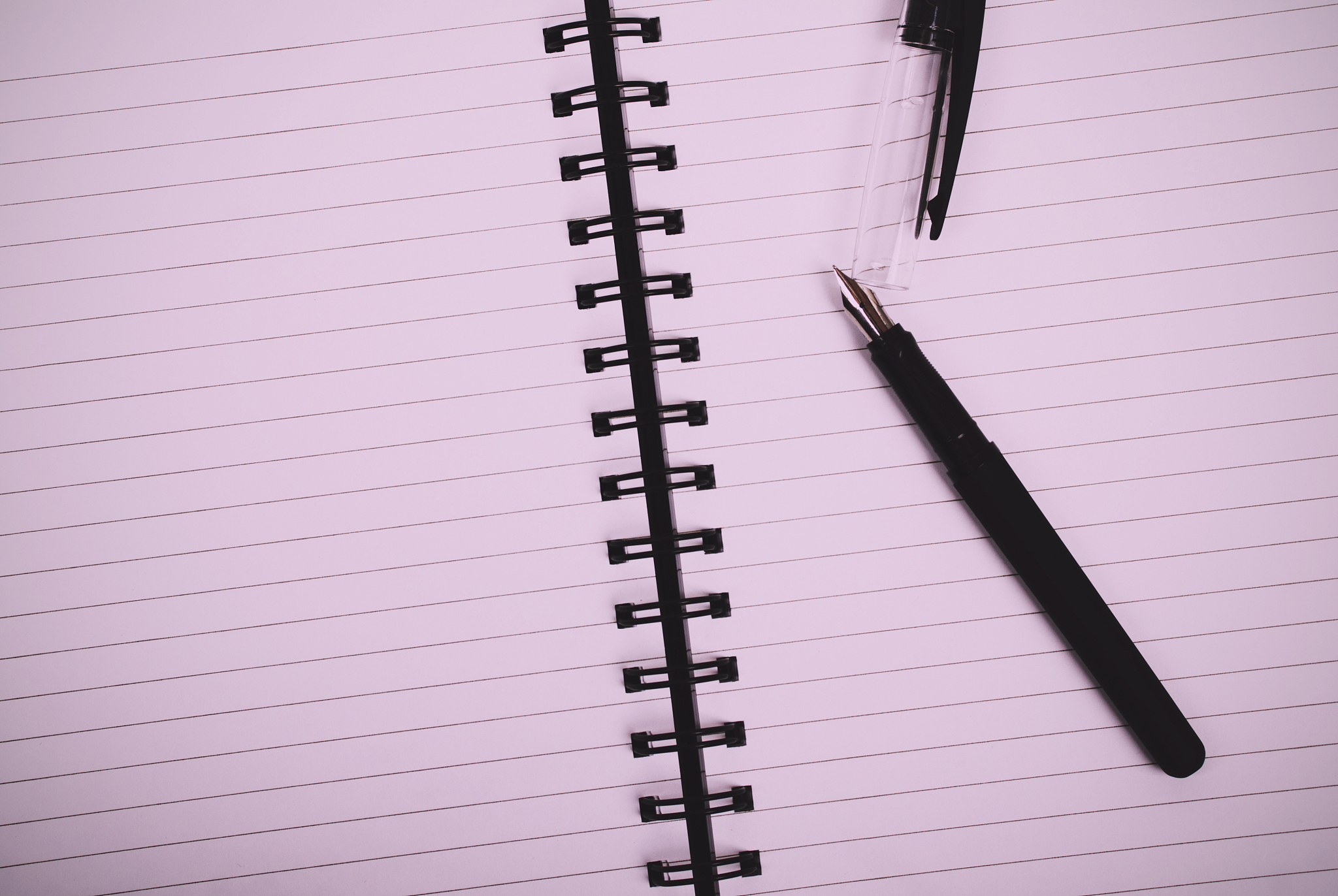 lay flat image of a notebook on a wooden surface
