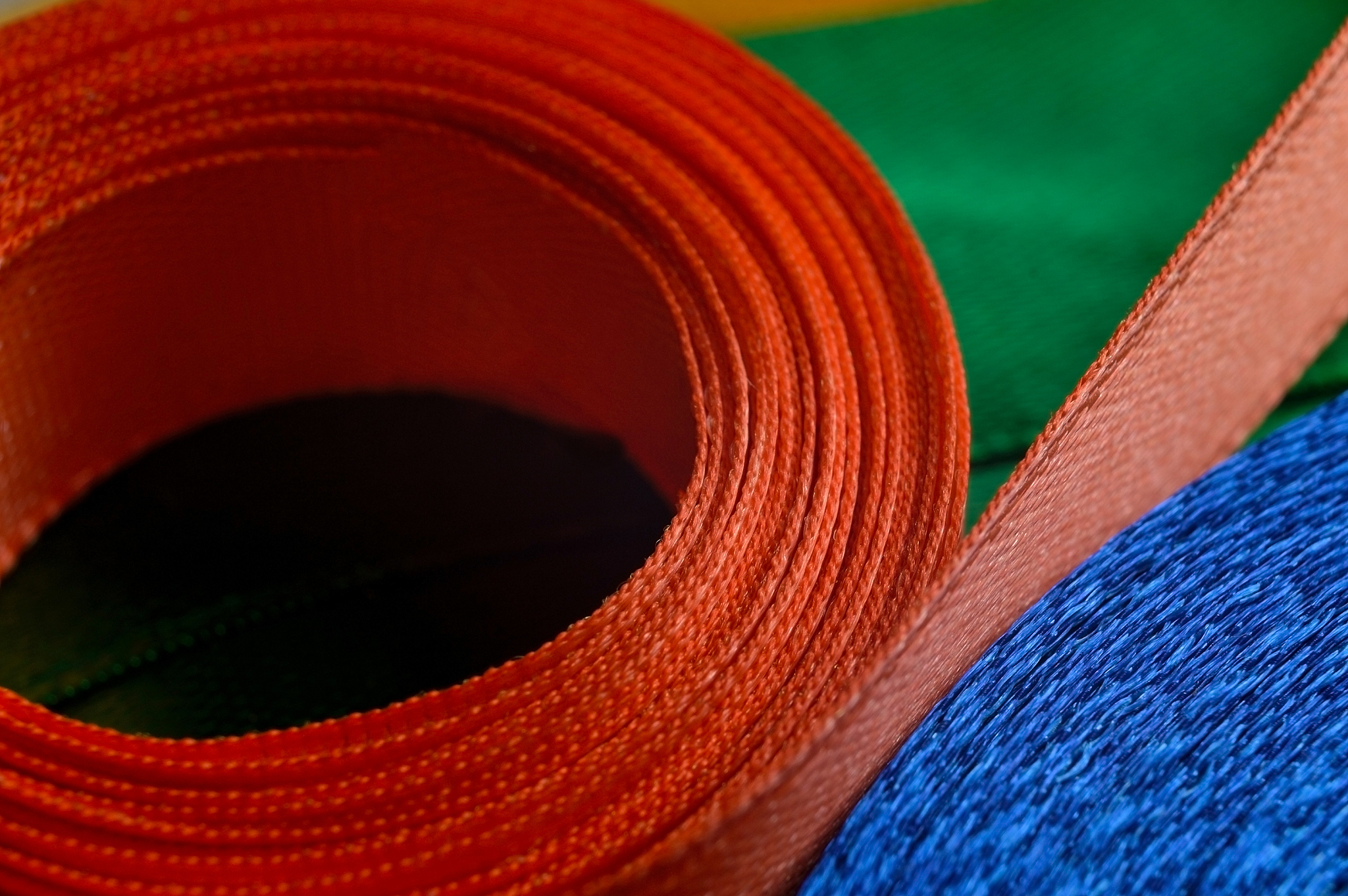 fabric ribbon of different colors twisted into an ellipse