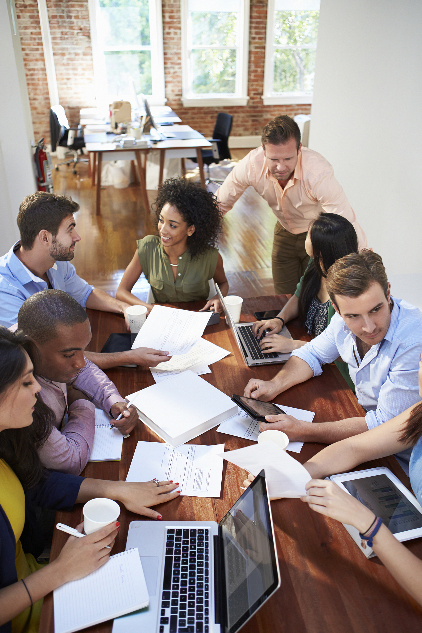 group of office workers meeting to discuss ideas