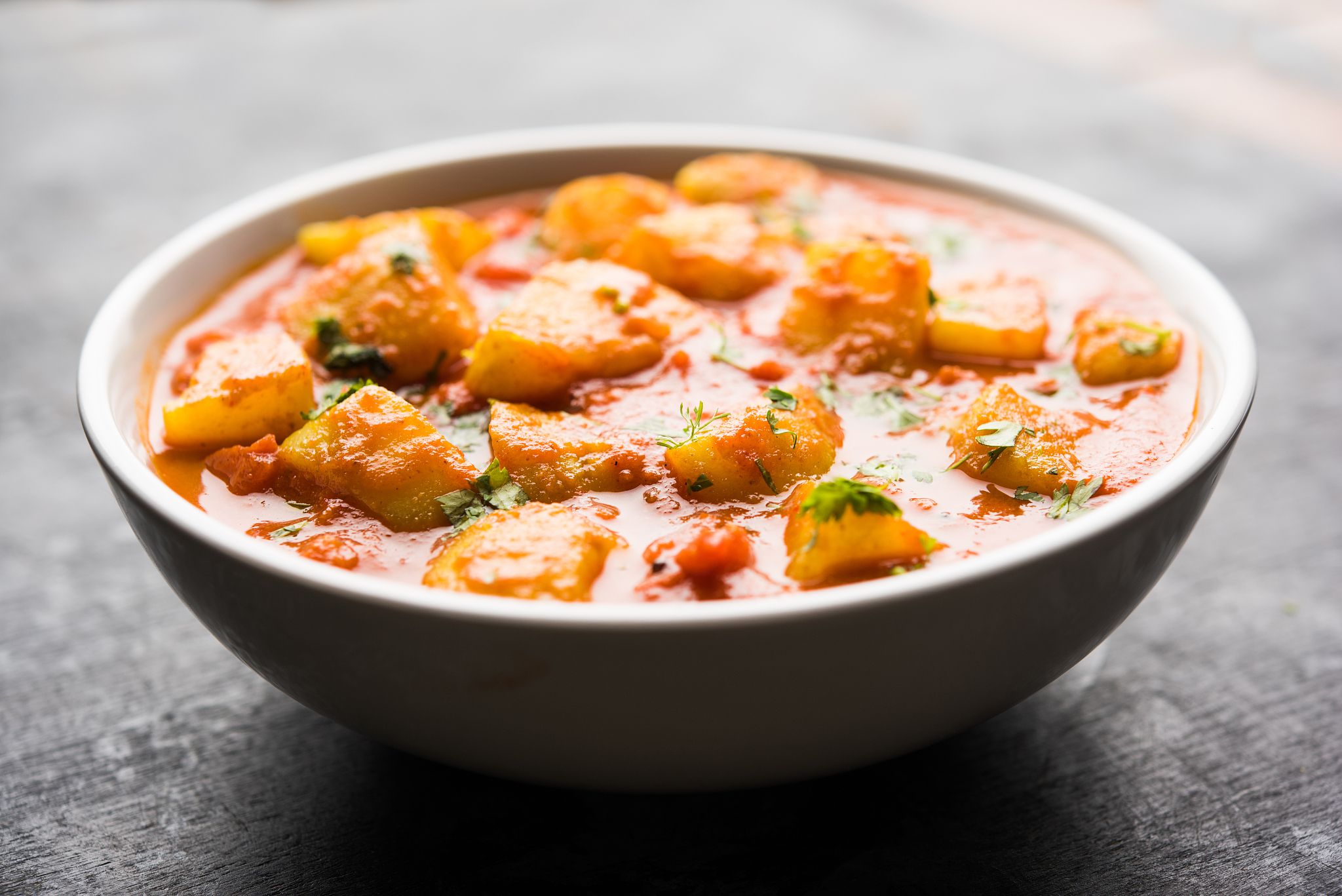 indian food - aloo curry masala. potato cooked with spices and h