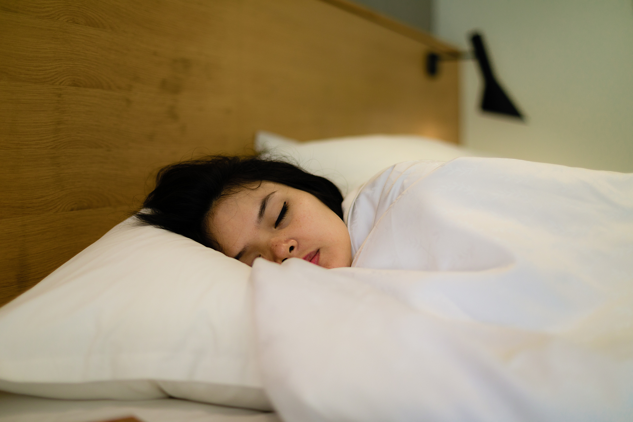 asian young woman sleeping at home
