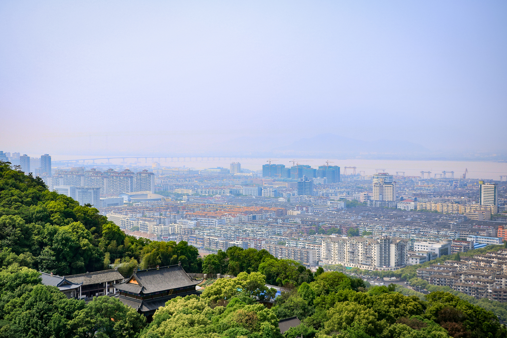 high angle view of buildings in city against clear sky