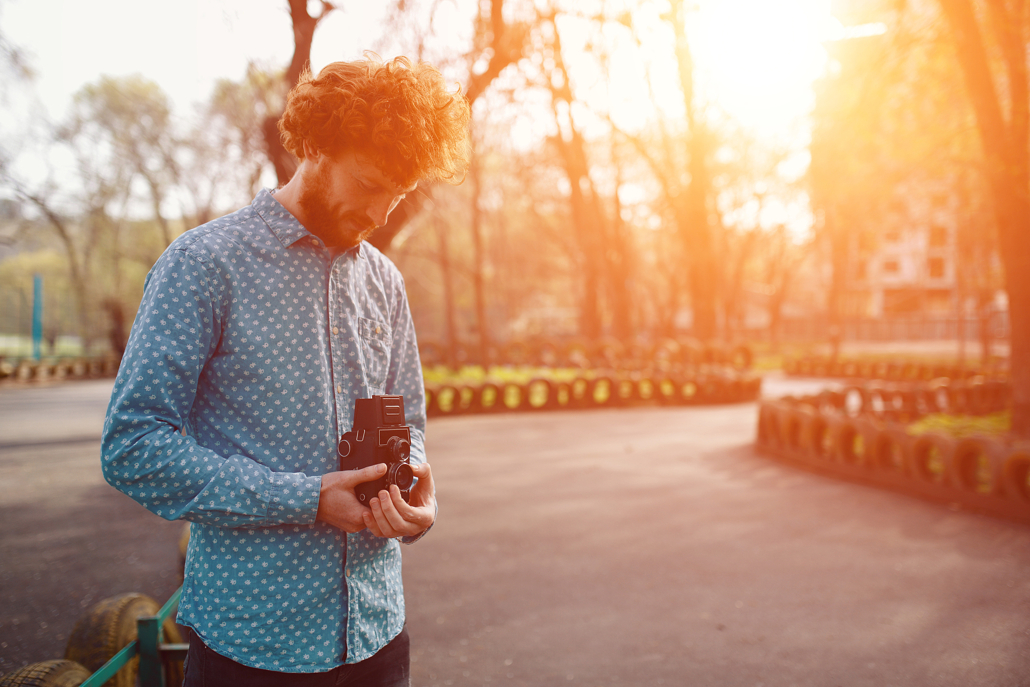 the red-haired guy holding a medium format film camera