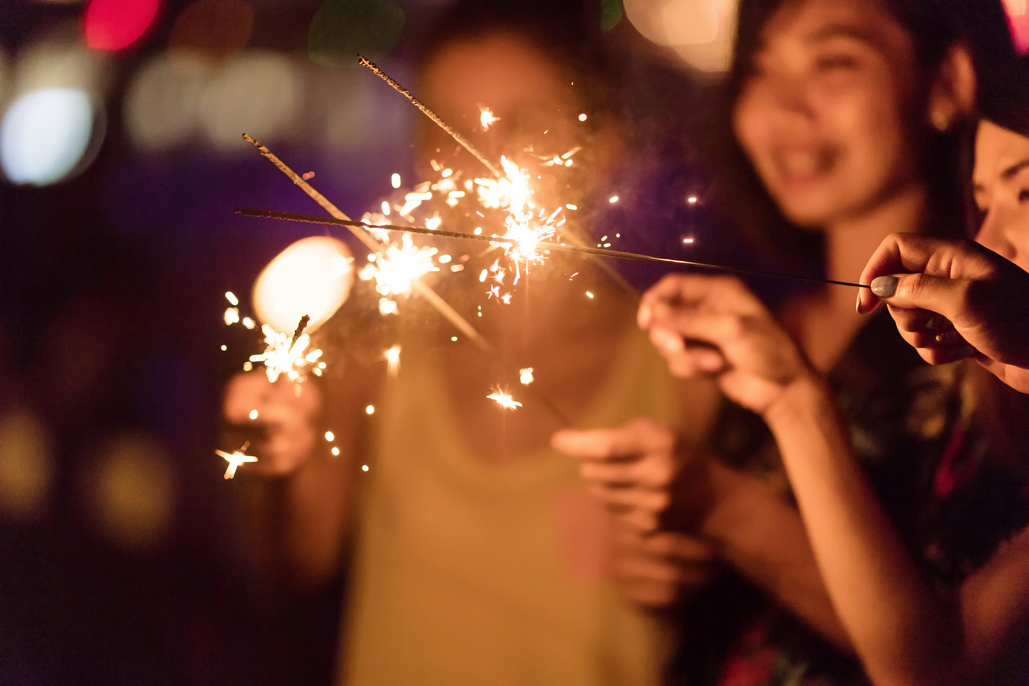 blurred of sparklers with group of friends having fun for celebr