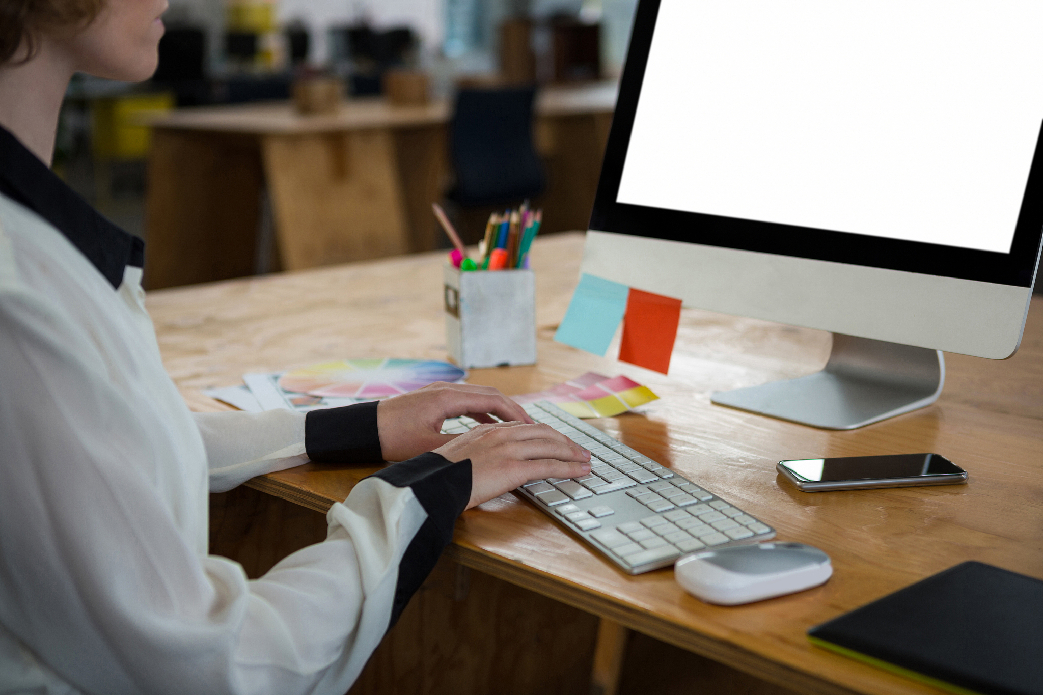 female graphic designer working at desk