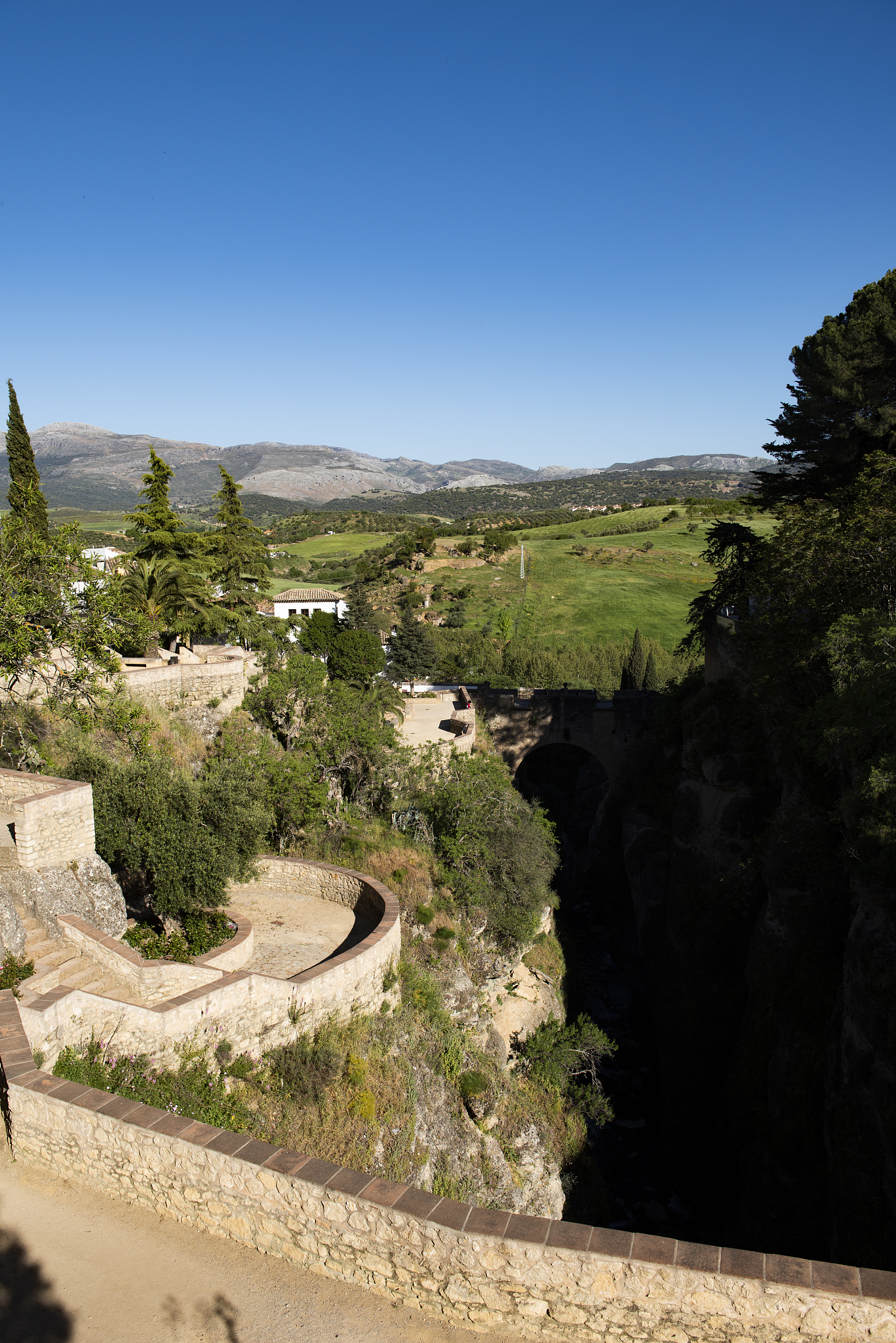 ancient wall of ronda, spain and the countryside beyond.