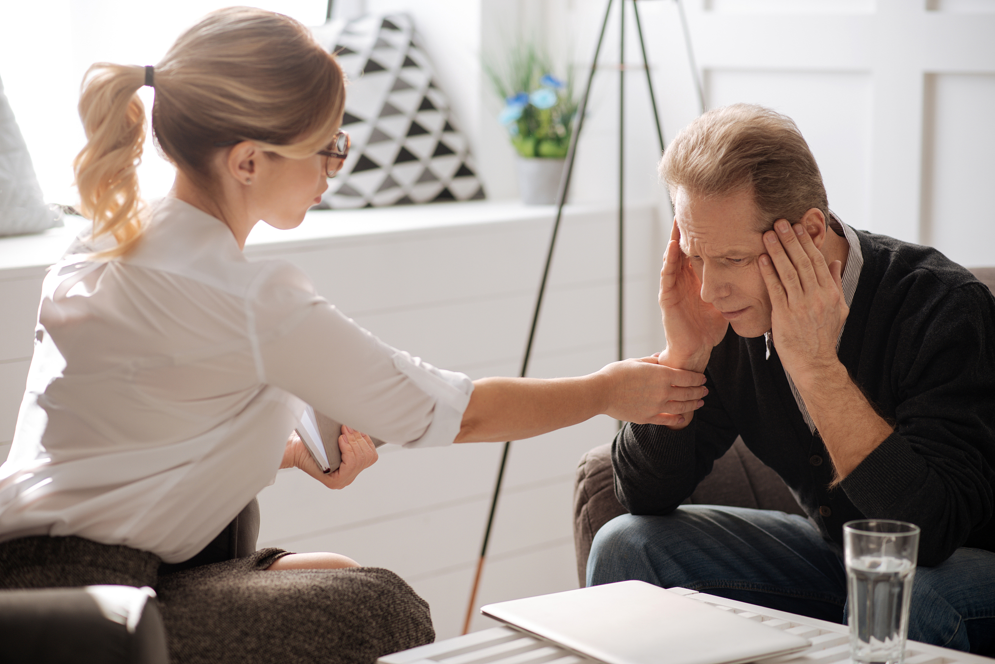 miserable cheerless man having a headache
