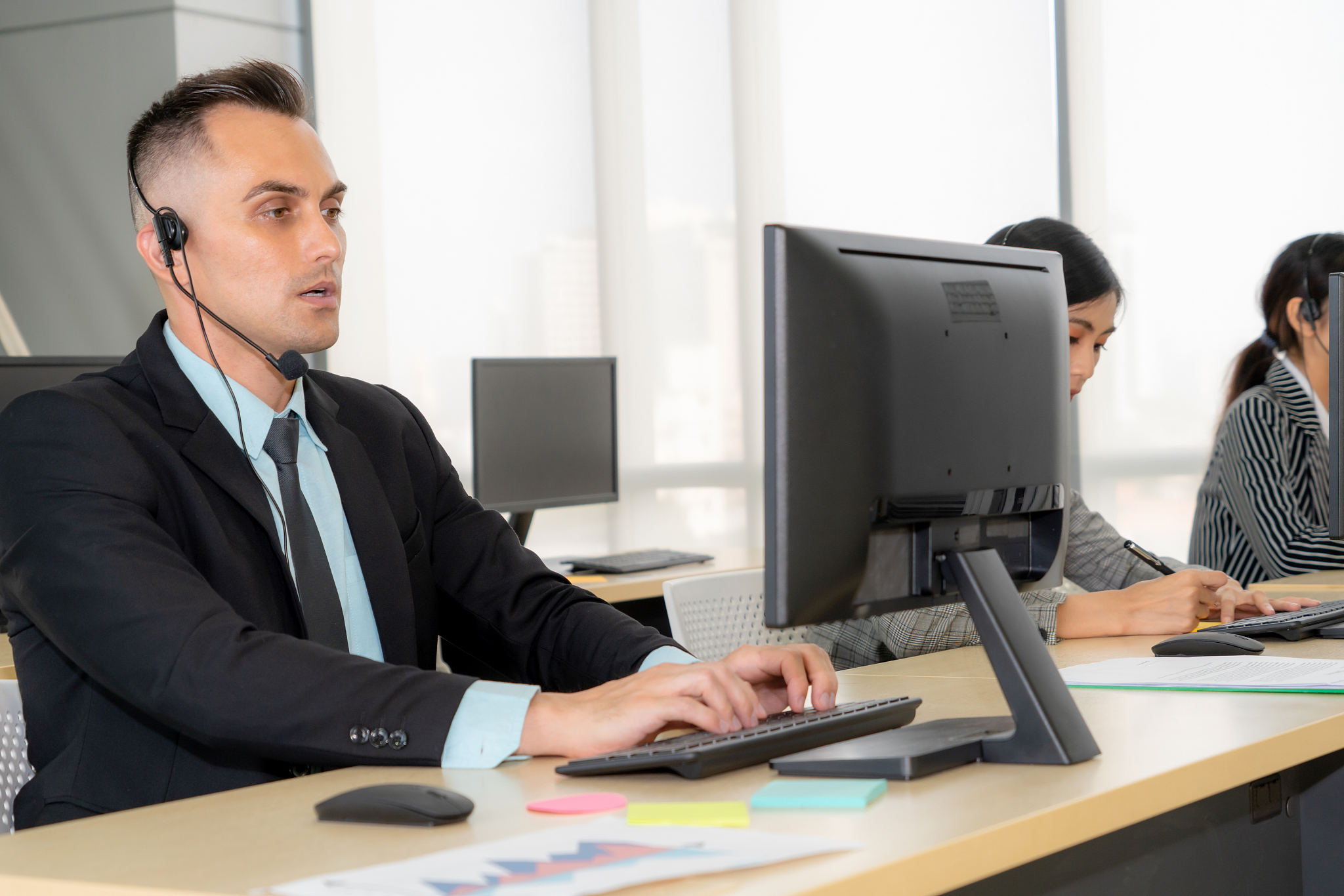 business people wearing headset working in office