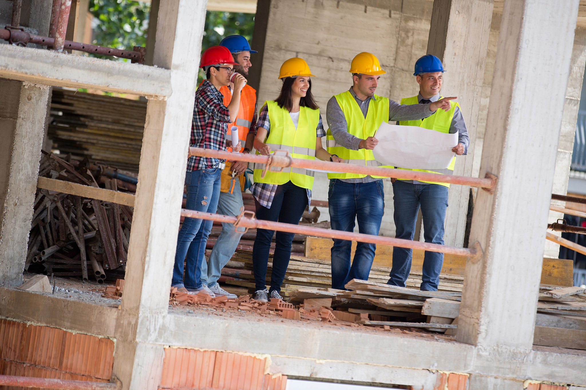 young engineer team show building place as planned