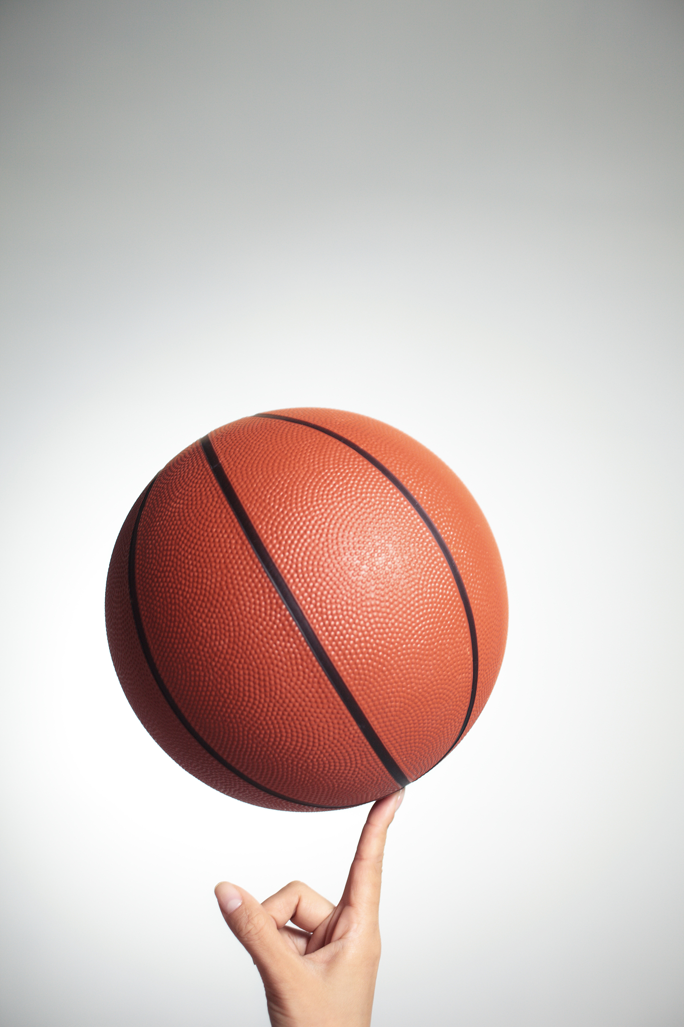 basketball on index finger,hands close-up