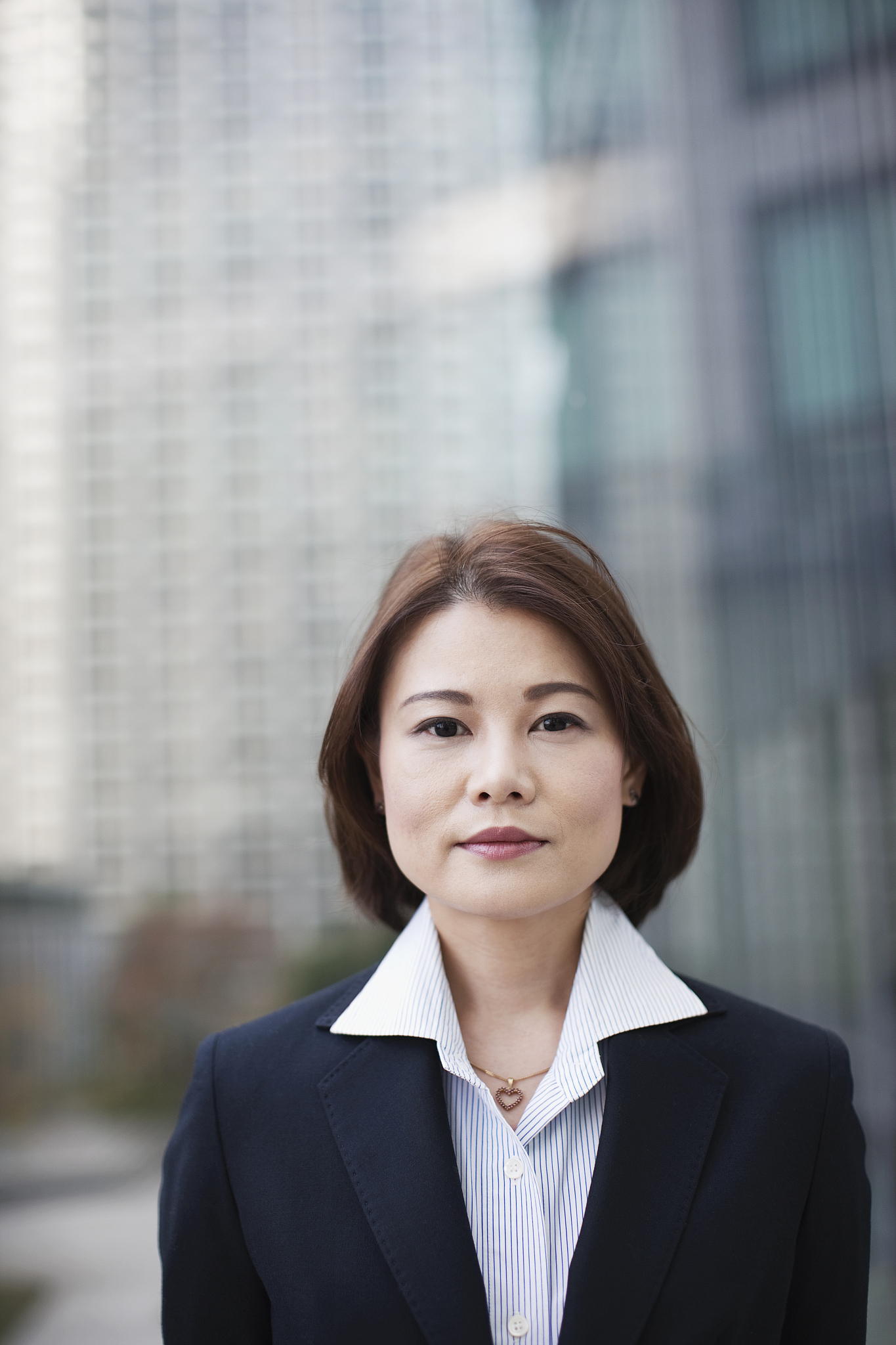 business woman in city with modern buildings
