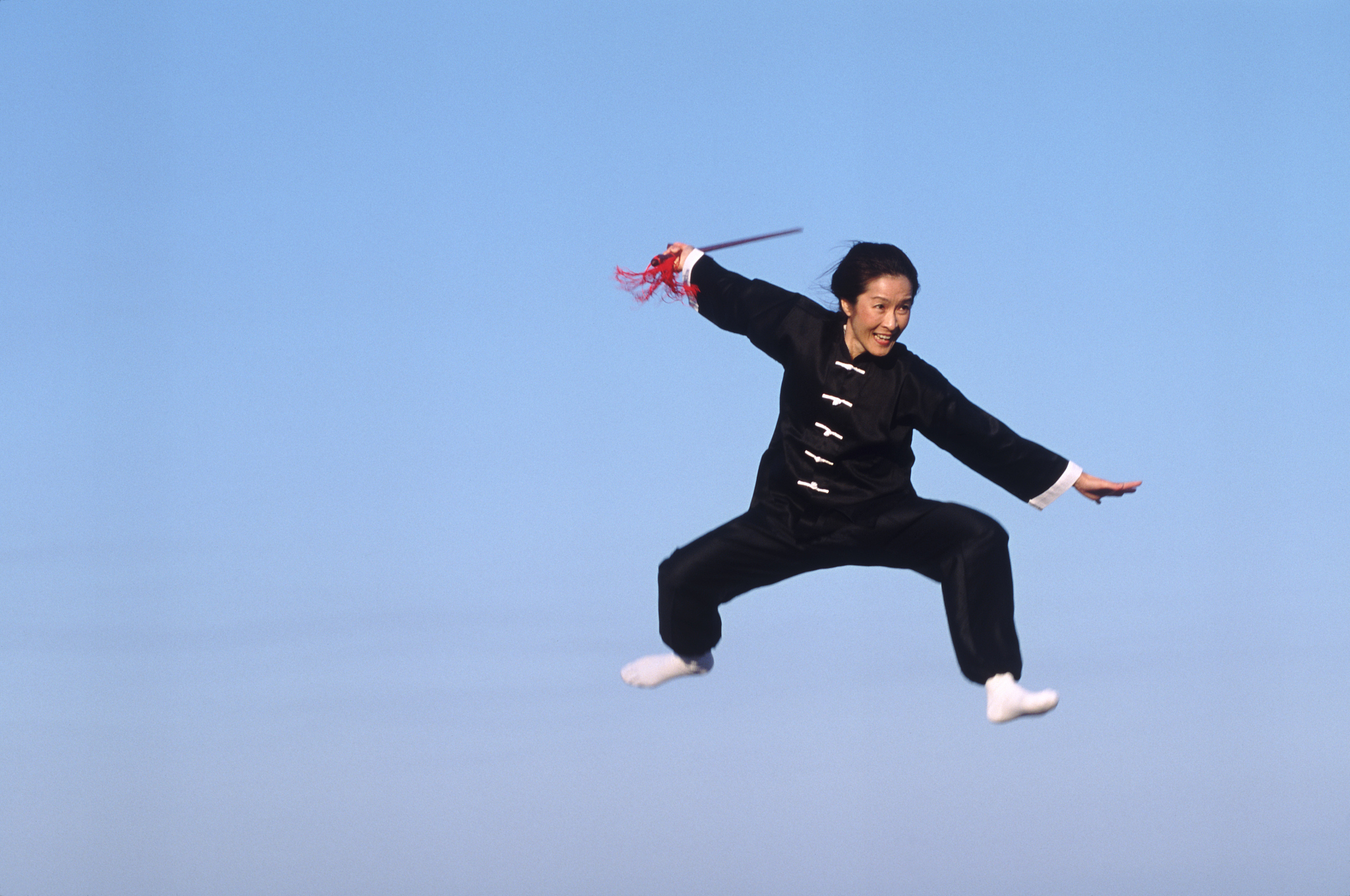 woman jumping during martial arts workout