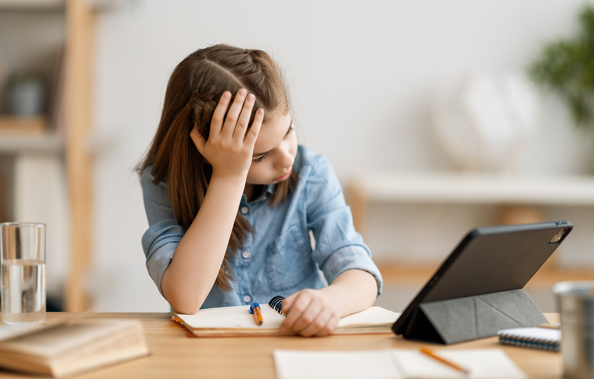 girl doing homework or online education.