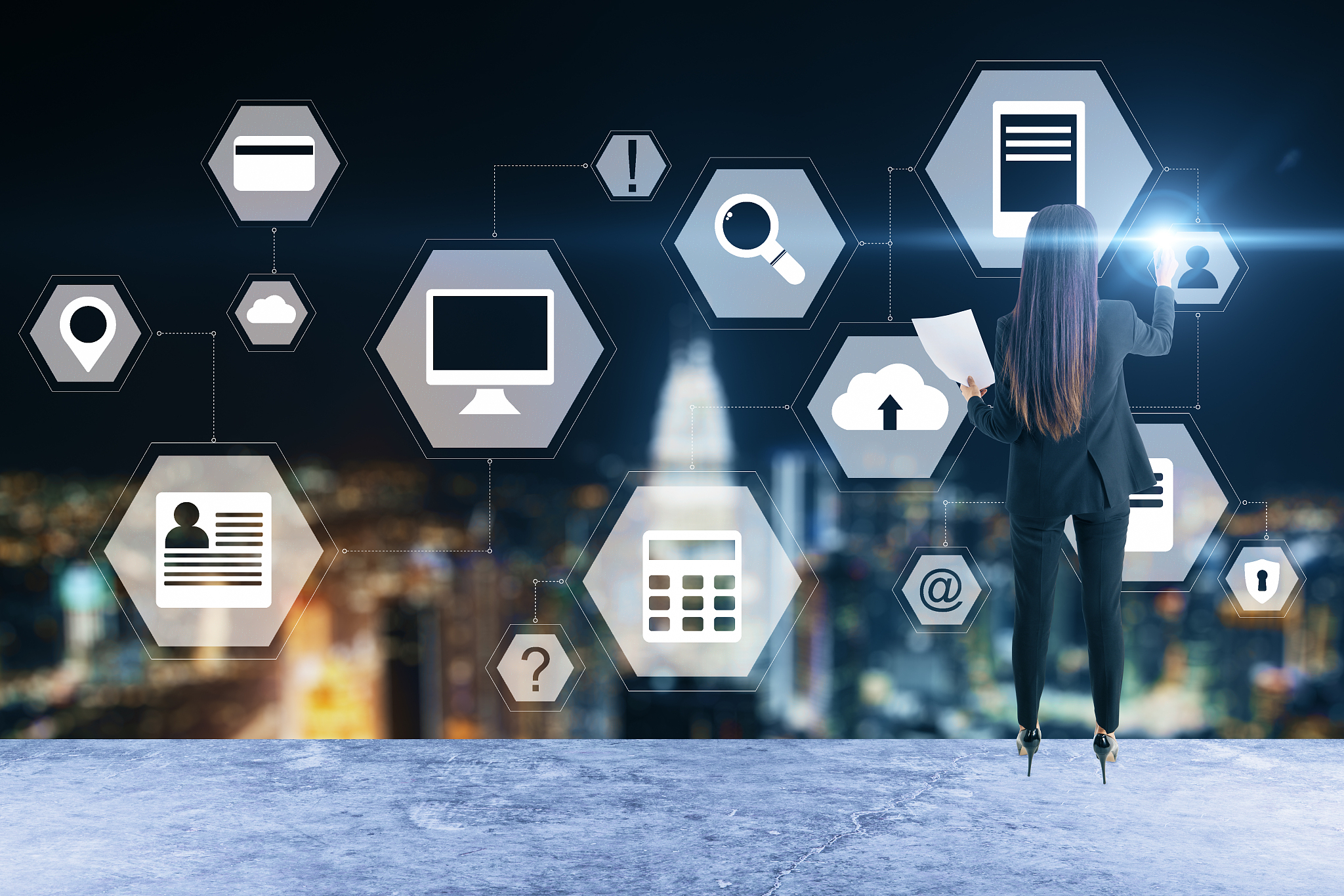 businesswoman and using glowing business analytics diagram.