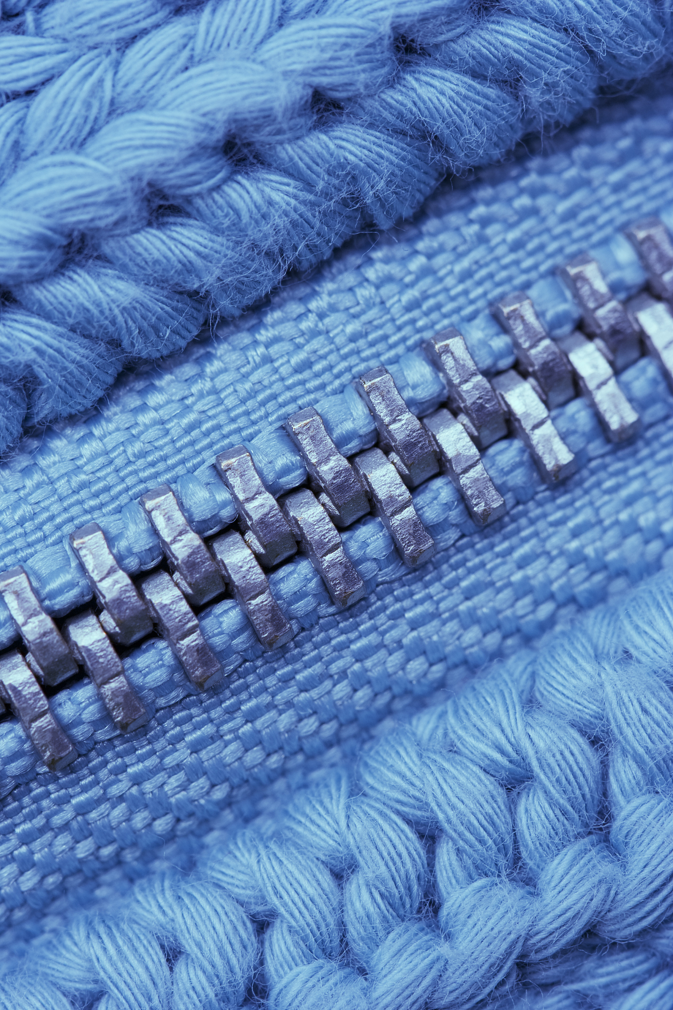 macro of closed zipper on sweater