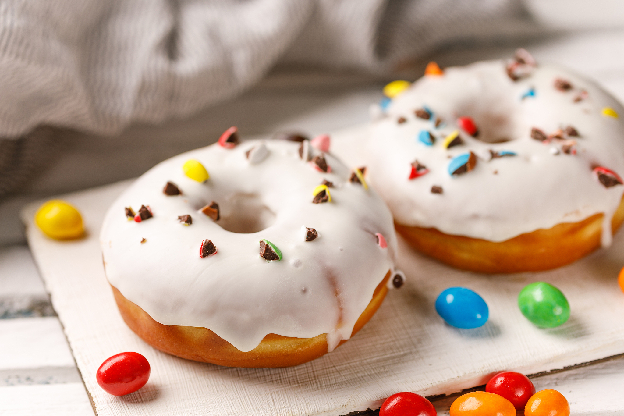 cookery, baking and food concept - closeup. donuts in white glaz