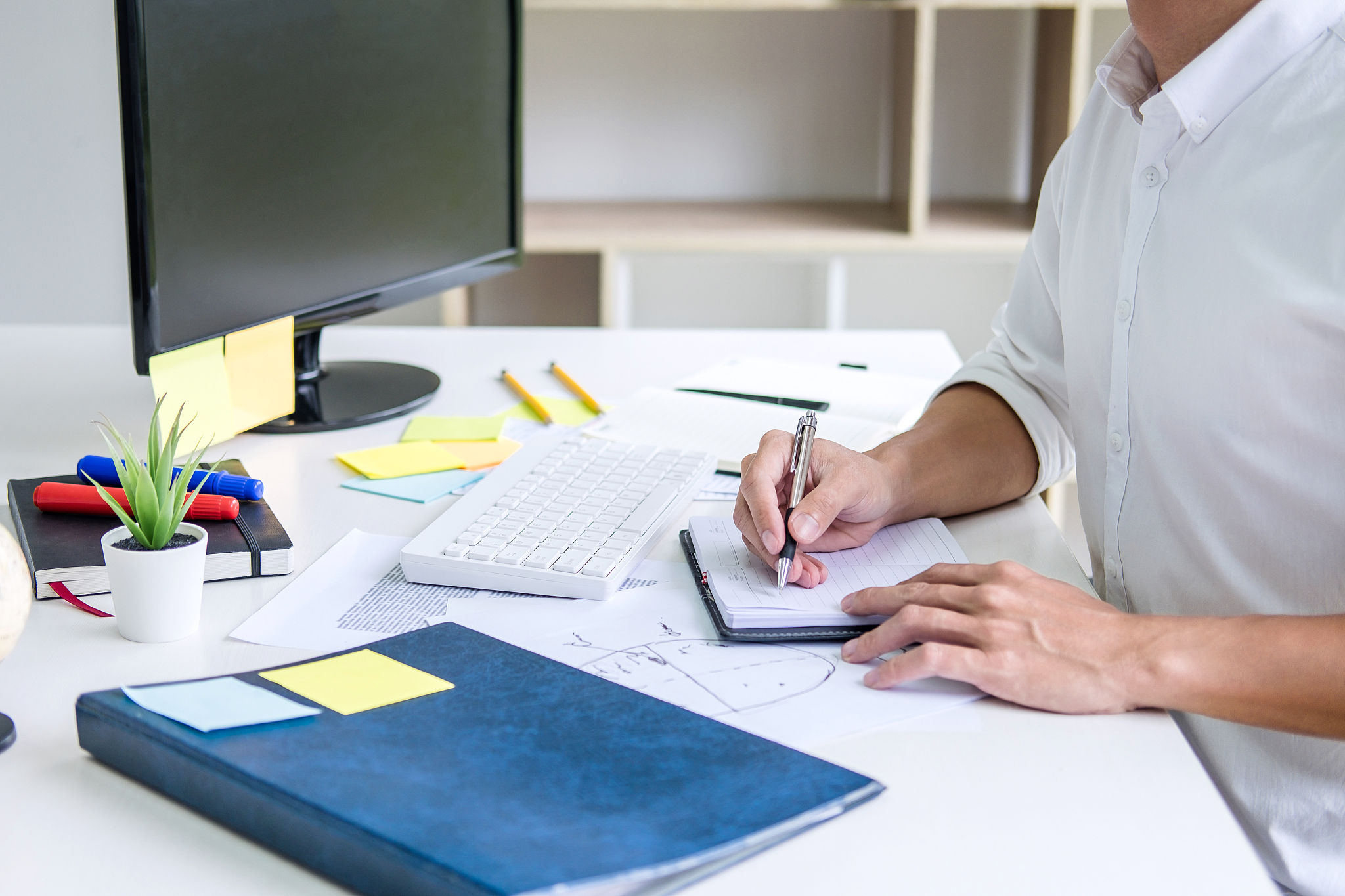 businessman working writing making note business plan and graphi