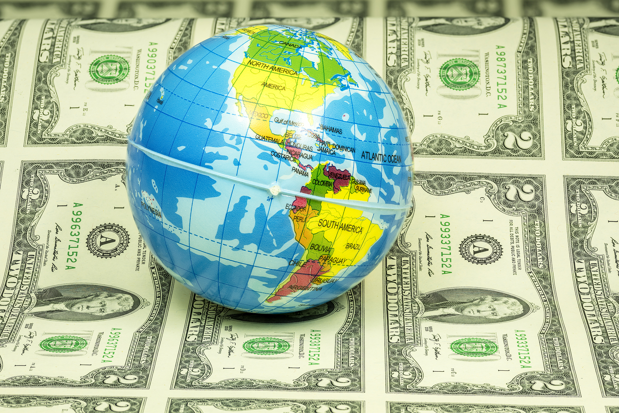 ball with the world showing usa on money