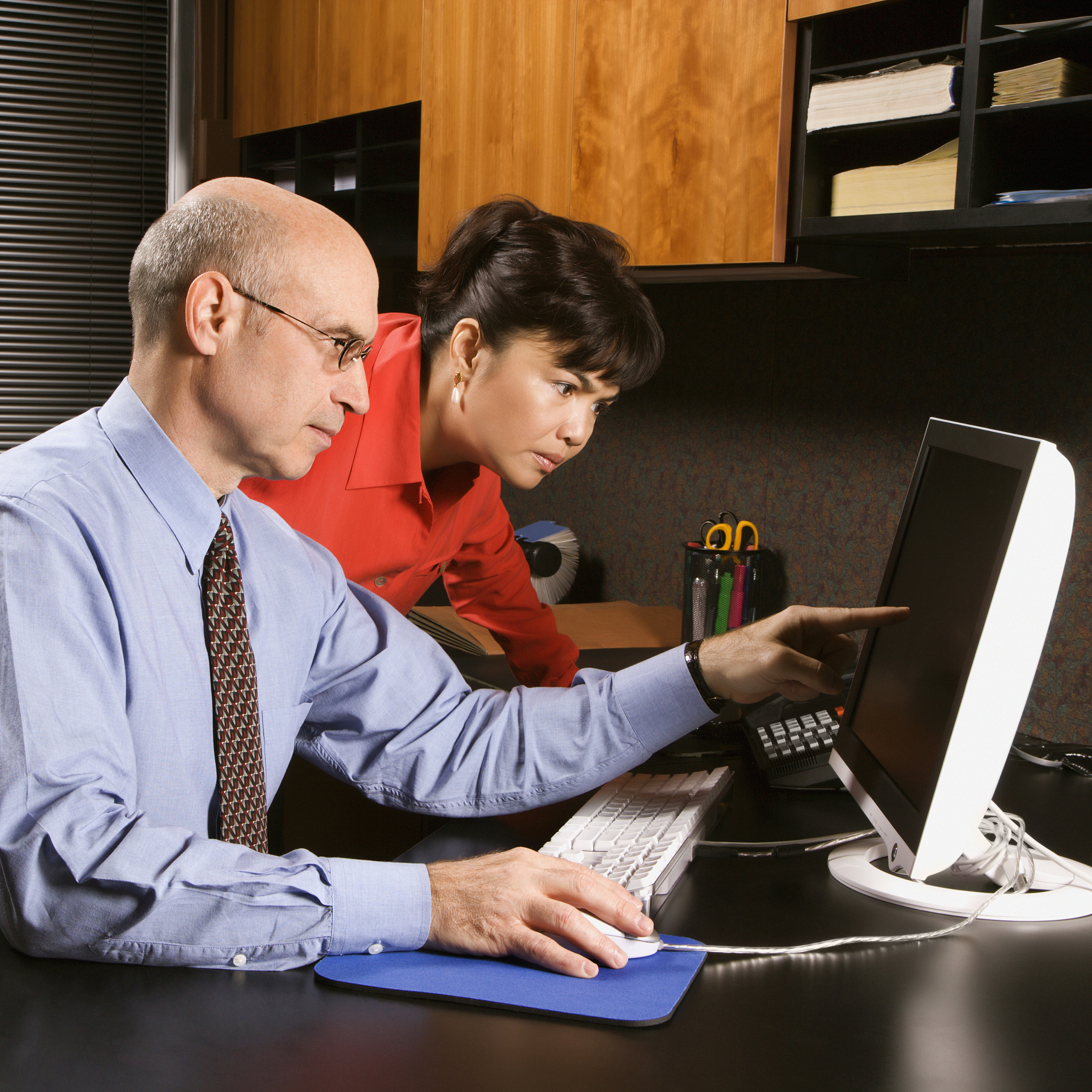businessman and businesswoman in office.
