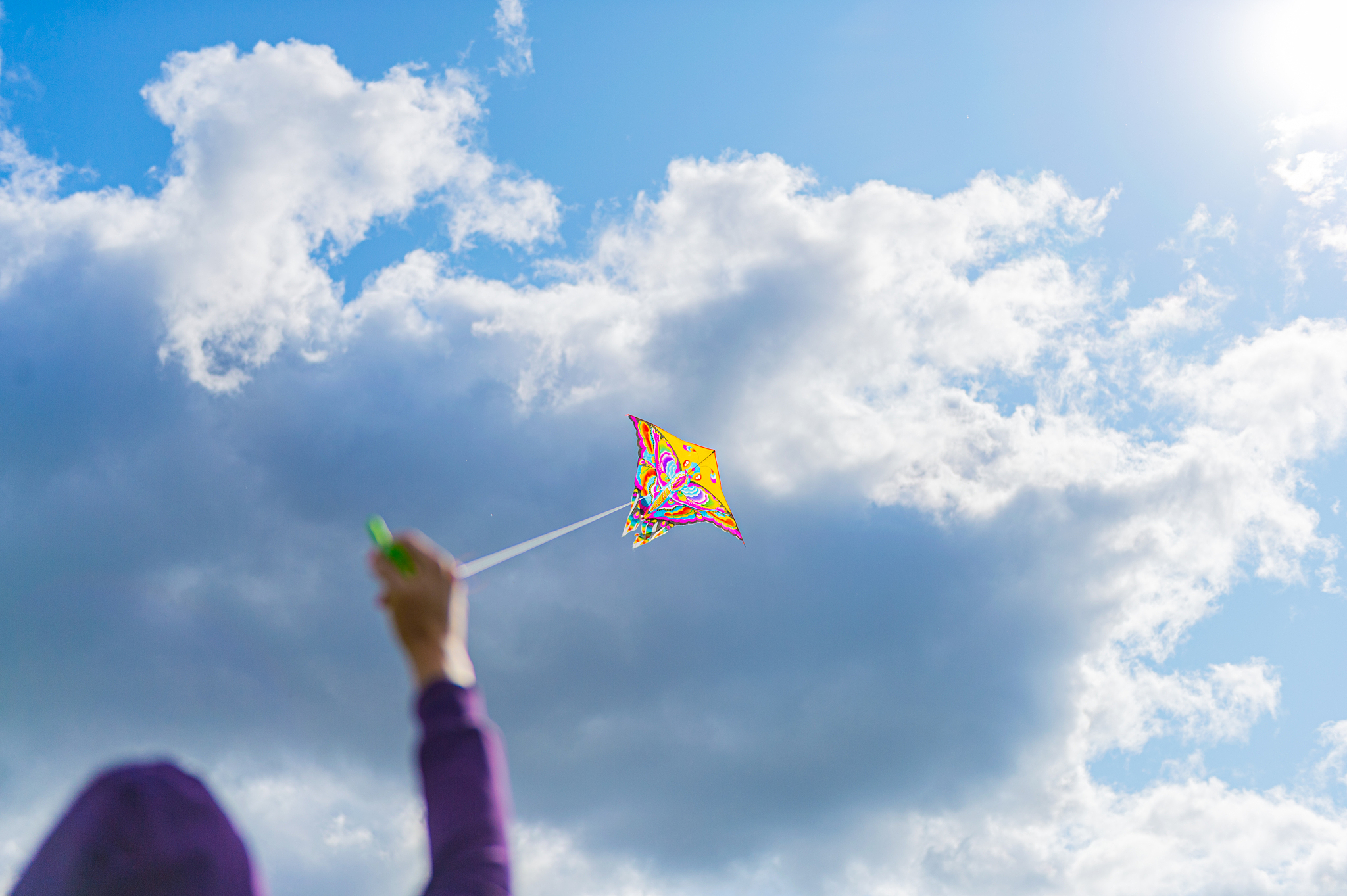 womans handing the rope while playing kite in the sky, enjoy lif