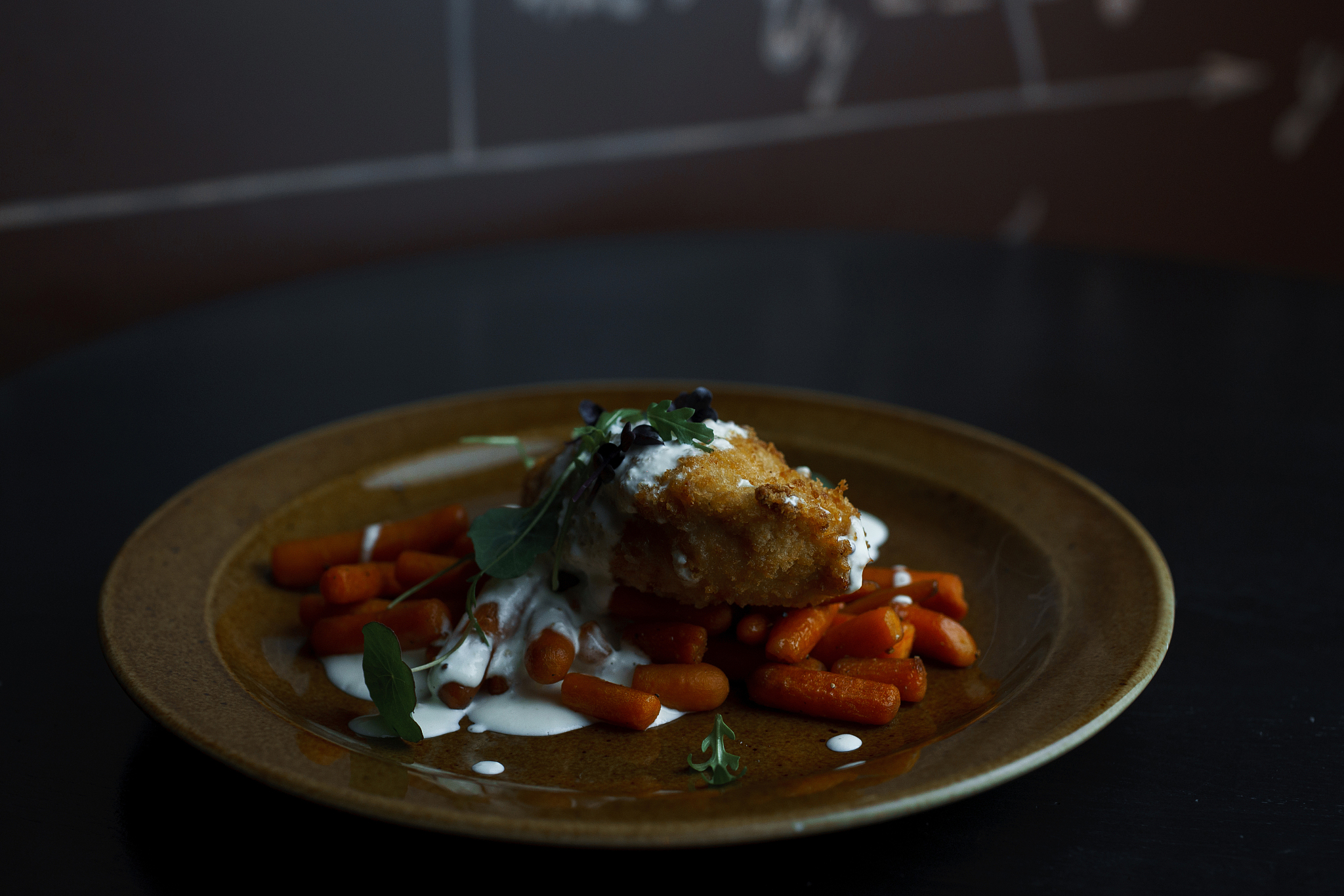 delicious lunch of chicken meat in breading with carrots, greens