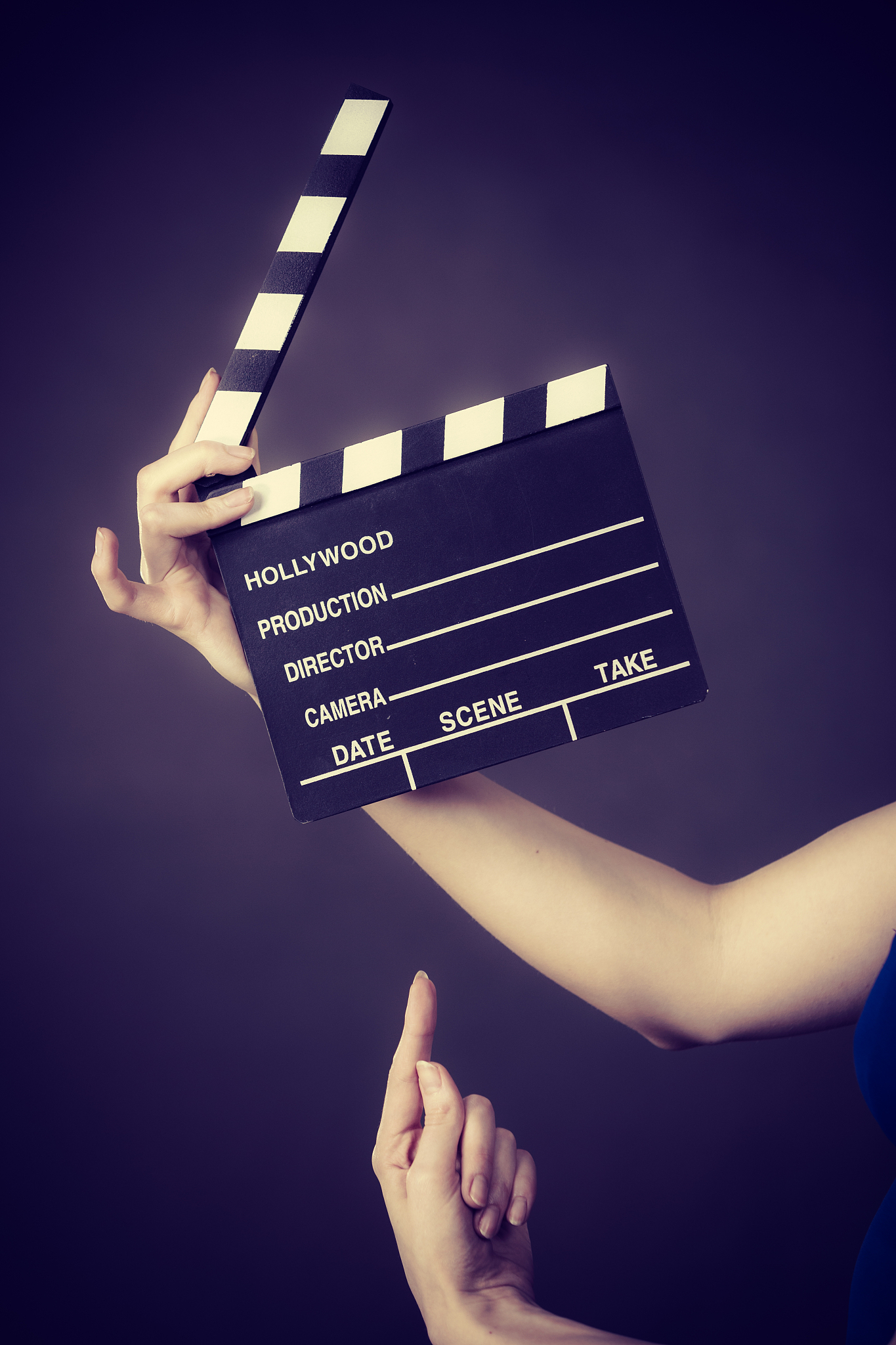 woman holding professional film slate