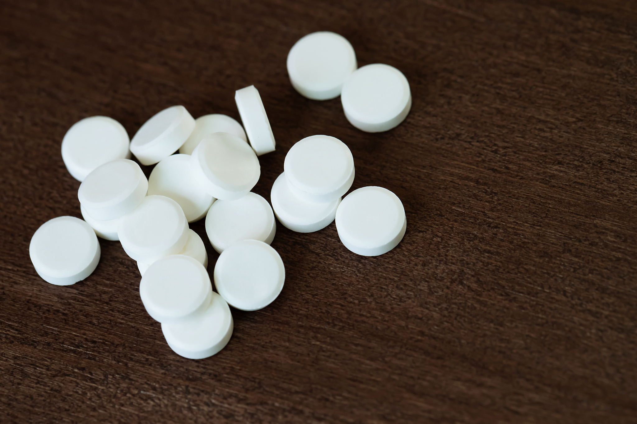 a lot of medication and white pills from above, falling out of i